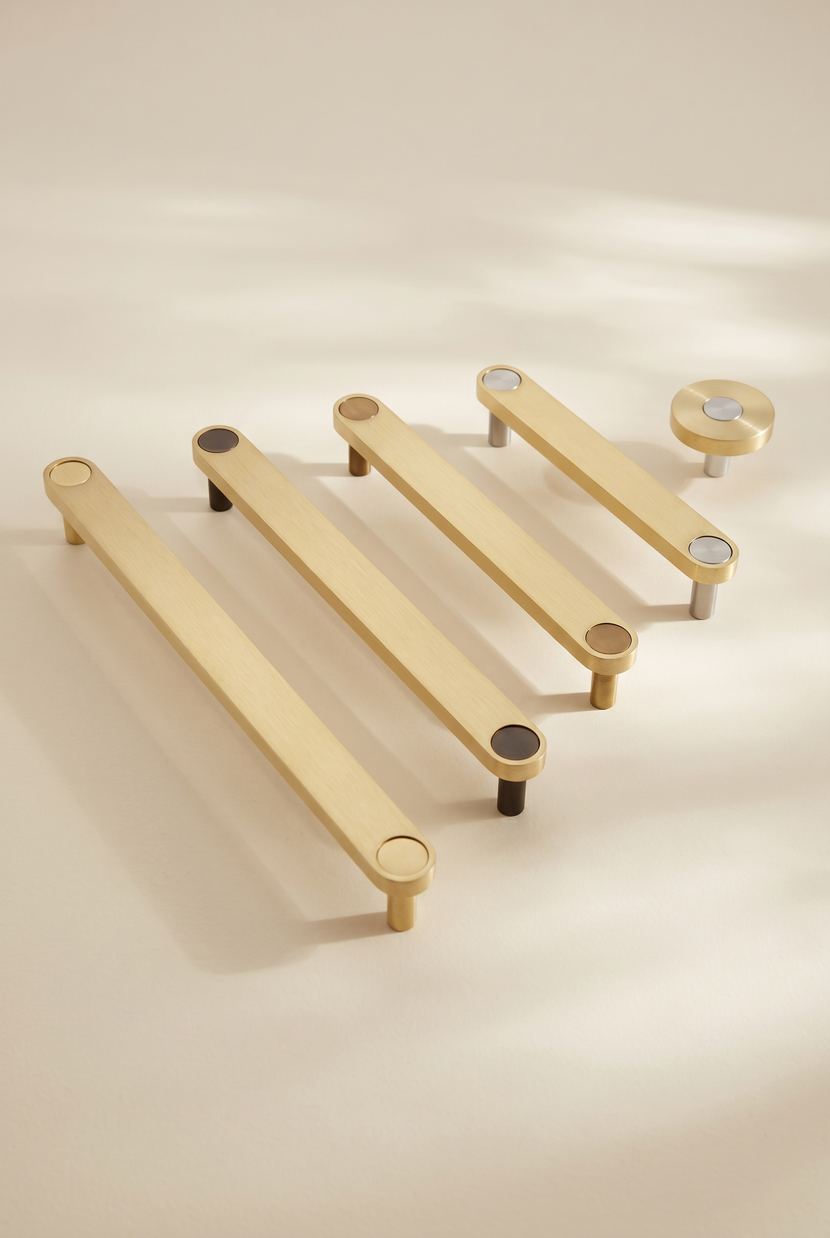 Brass Ensemble knob and four bar handles in 128, 160, 192 and 224mm centres