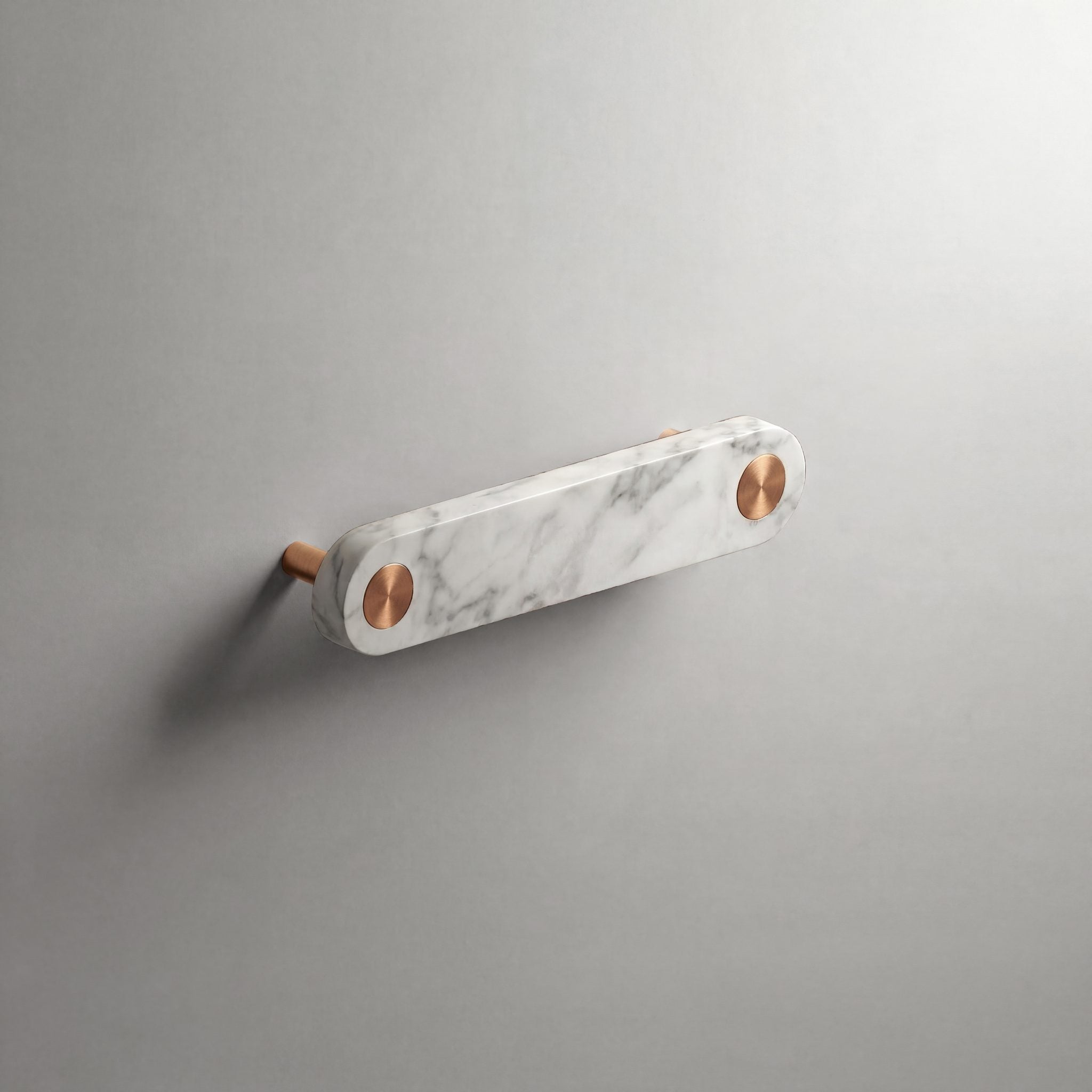 White Marble Ensemble Handle in 128mm Centres with Brushed Copper button detail by Sloan Roberts.