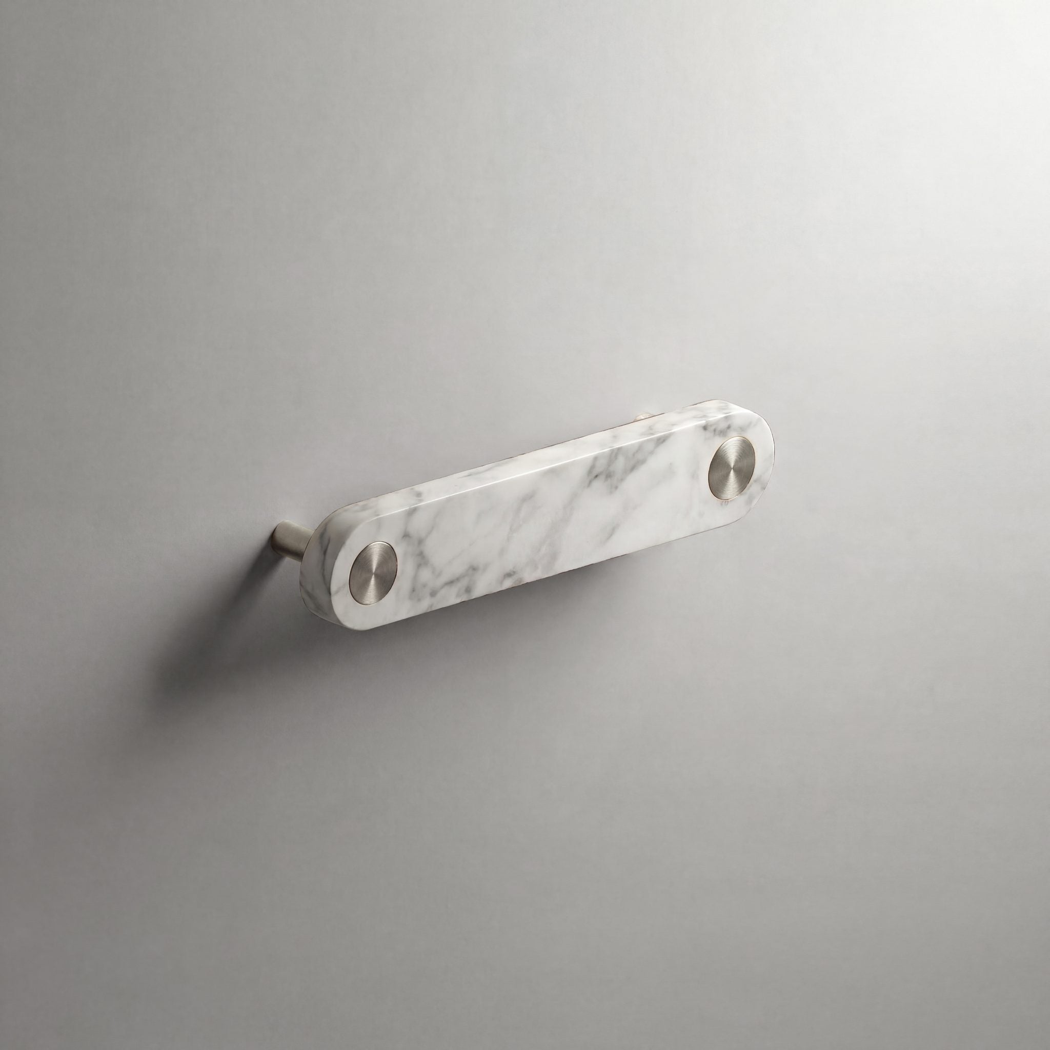 White Marble Ensemble Handle in 128mm Centres with Brushed Steel button detail by Sloan Roberts.