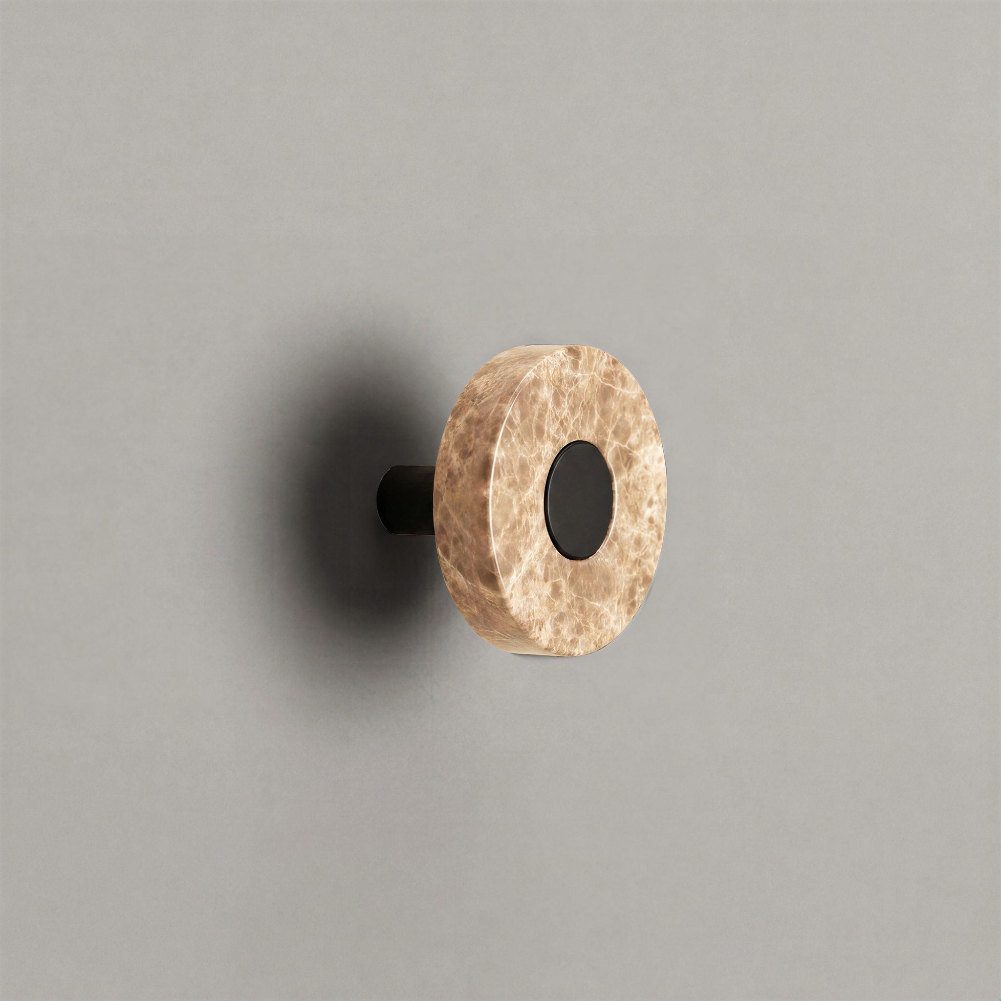 Latte Marble Ensemble Handle in Knob size with Matte Black button detail by Sloan Roberts.