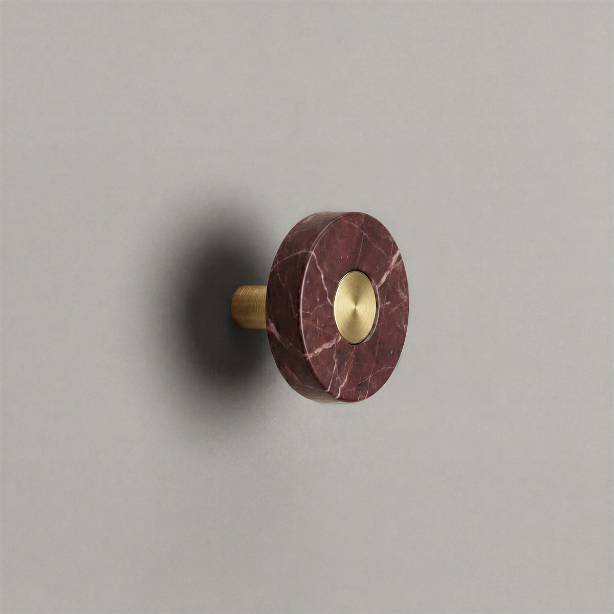 Red Marble Ensemble Handle in Knob size with Brass button detail by Sloan Roberts.