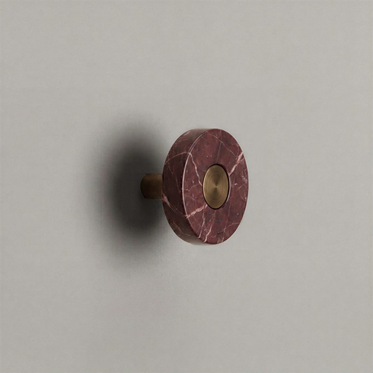Red Marble Ensemble Handle in Knob size with Aged Bronze button detail by Sloan Roberts.