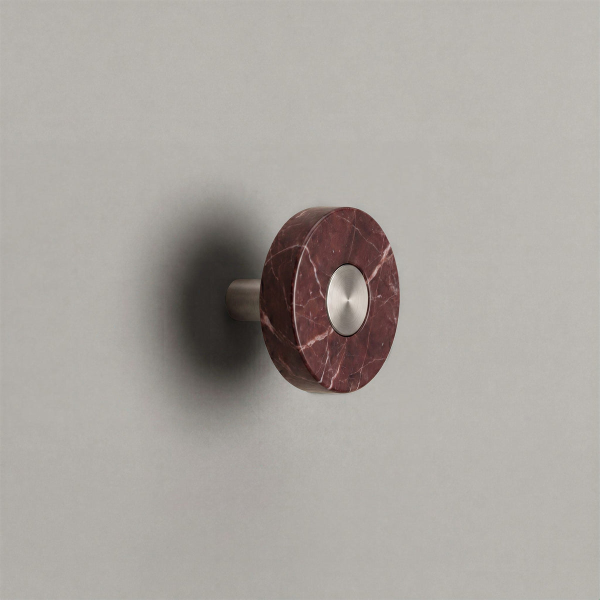 Red Marble Ensemble Handle in Knob size with Brushed Steel button detail by Sloan Roberts.