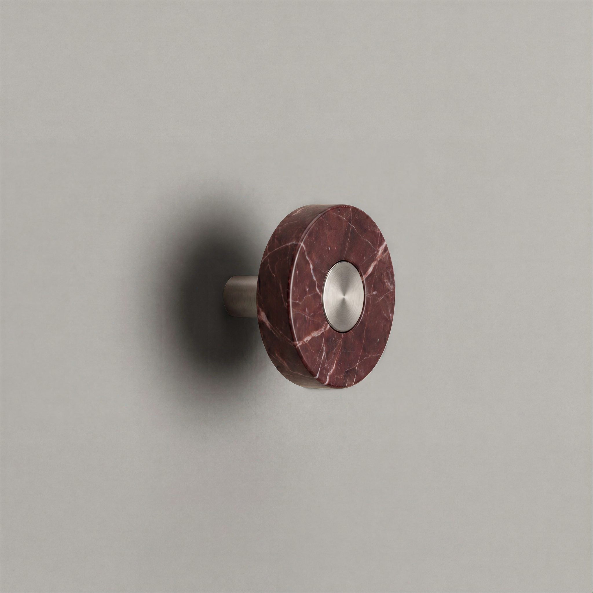 Red Marble Ensemble Handle in Knob size with Brushed Steel button detail by Sloan Roberts.