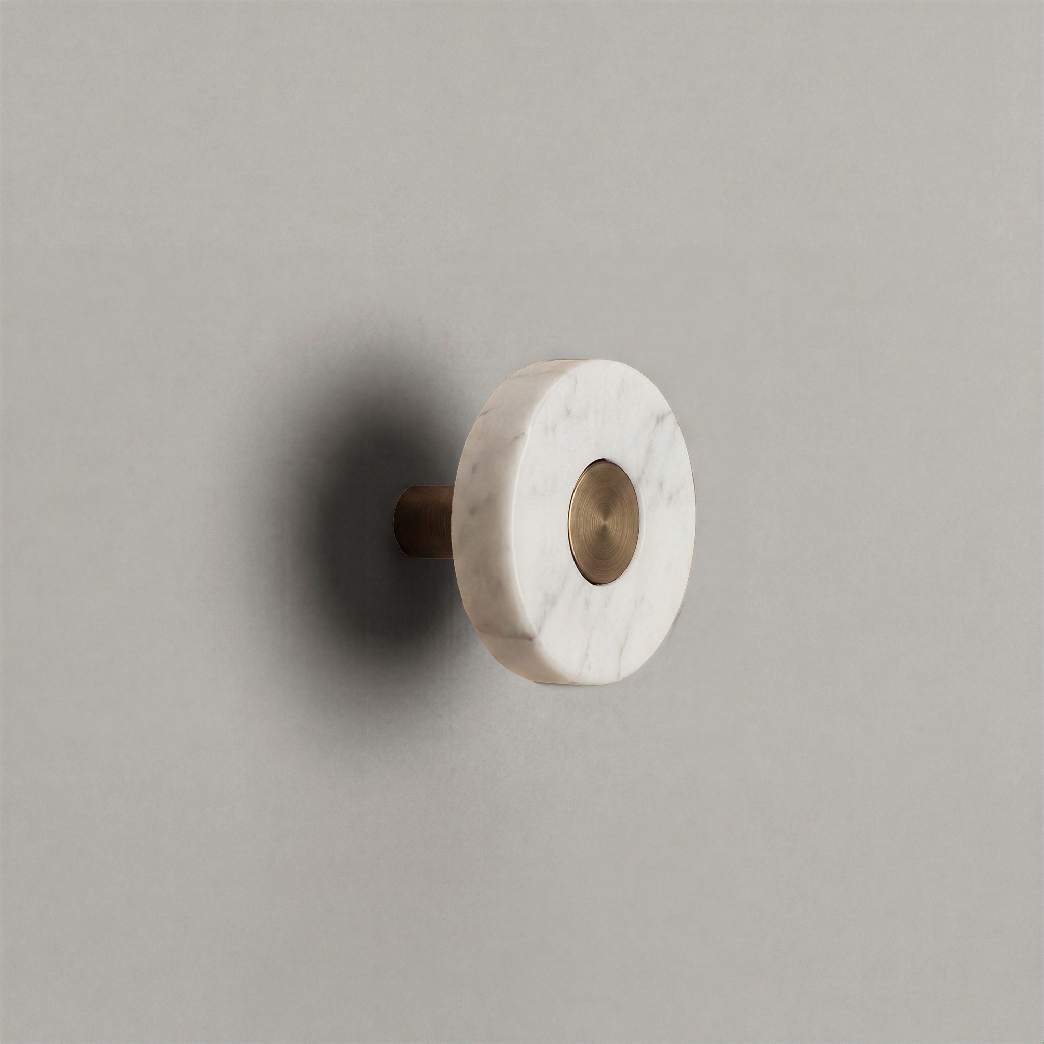 White Marble Ensemble Handle in Knob size with Aged Bronze button detail by Sloan Roberts.