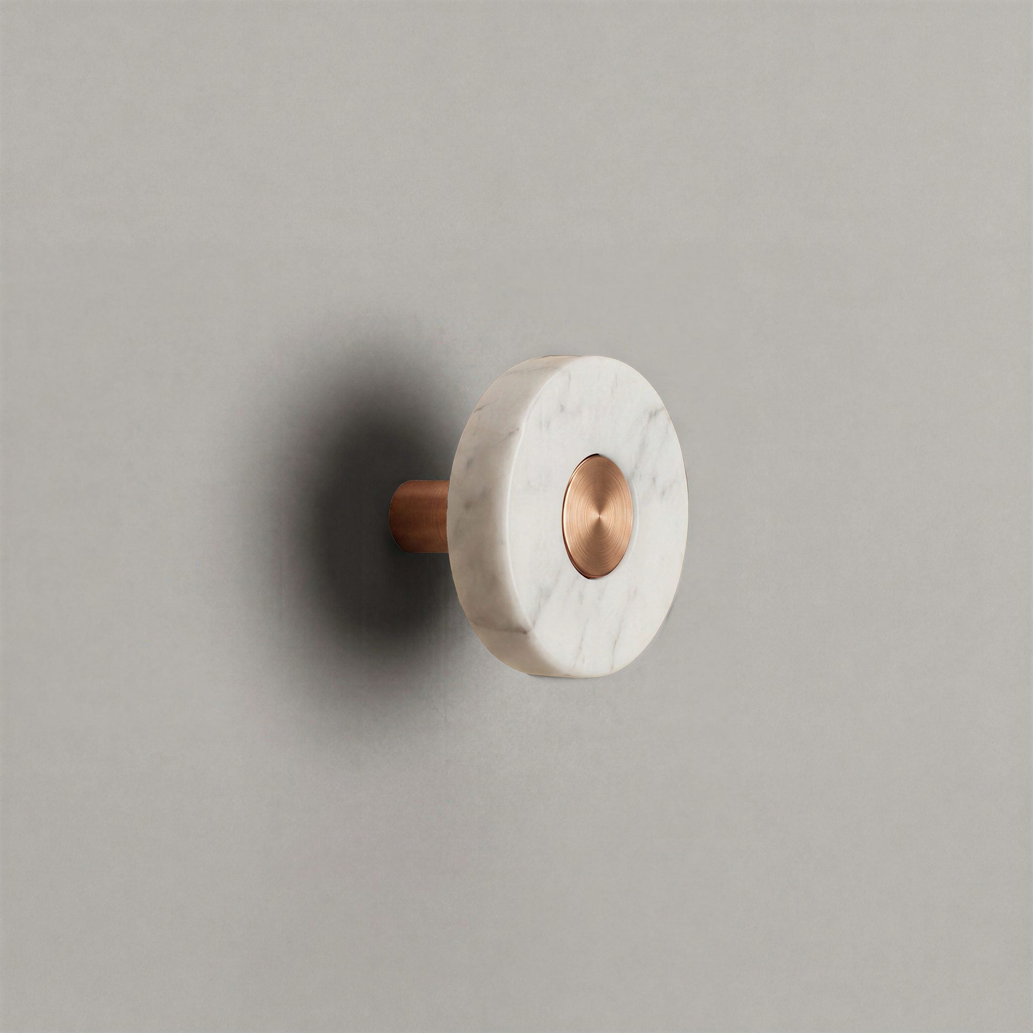 White Marble Ensemble Handle in Knob size with Brushed Copper button detail by Sloan Roberts.