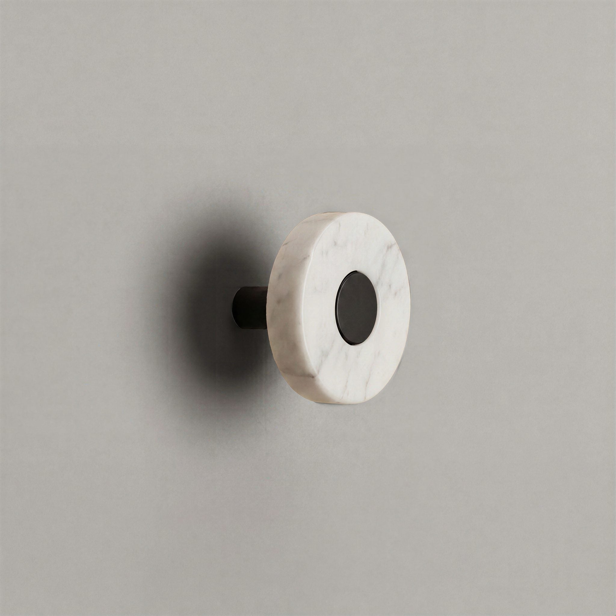 White Marble Ensemble Handle in Knob size with Matte Black button detail by Sloan Roberts.