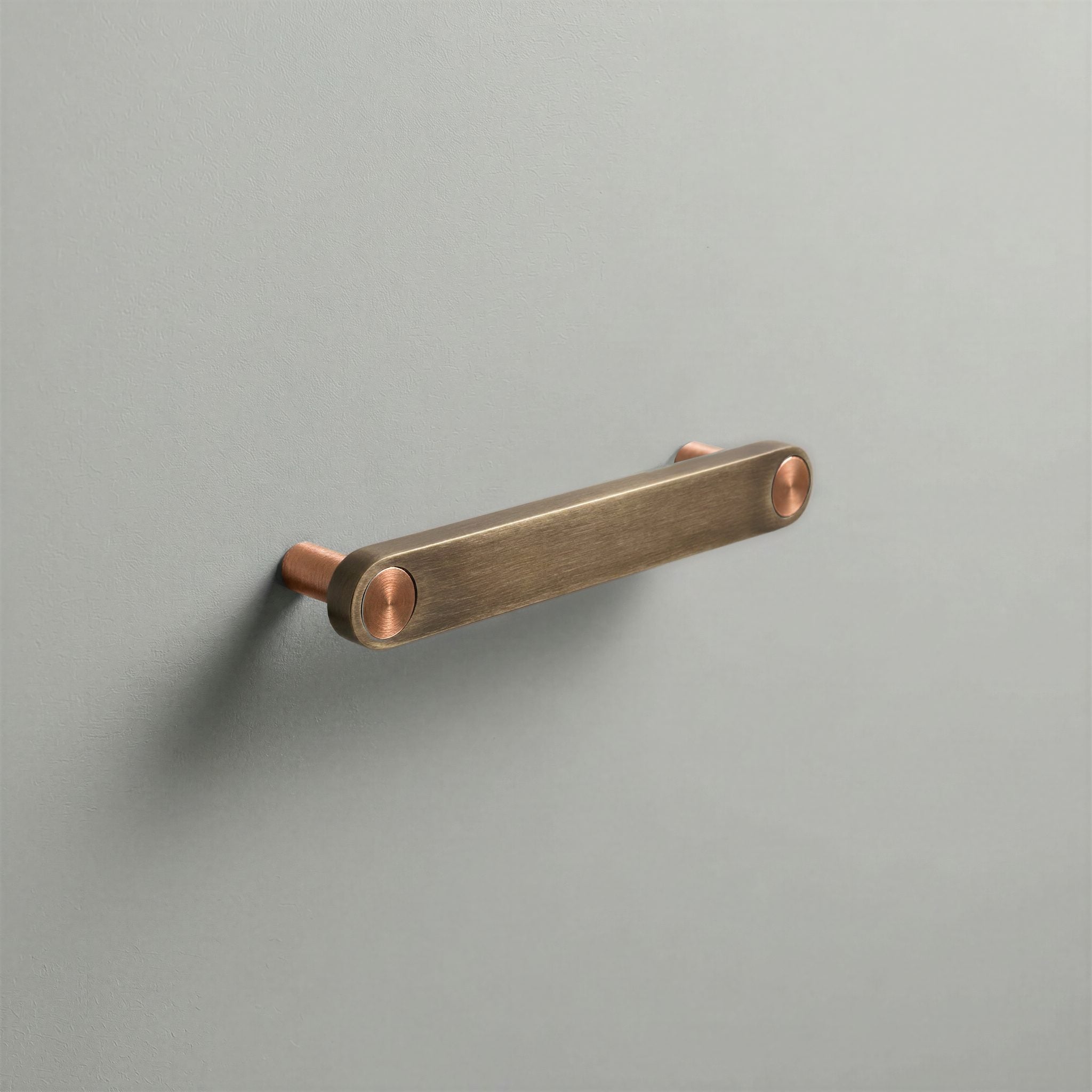 Aged Bronze Ensemble Handle in 128mm Centres with Brushed Copper button detail by Sloan Roberts.