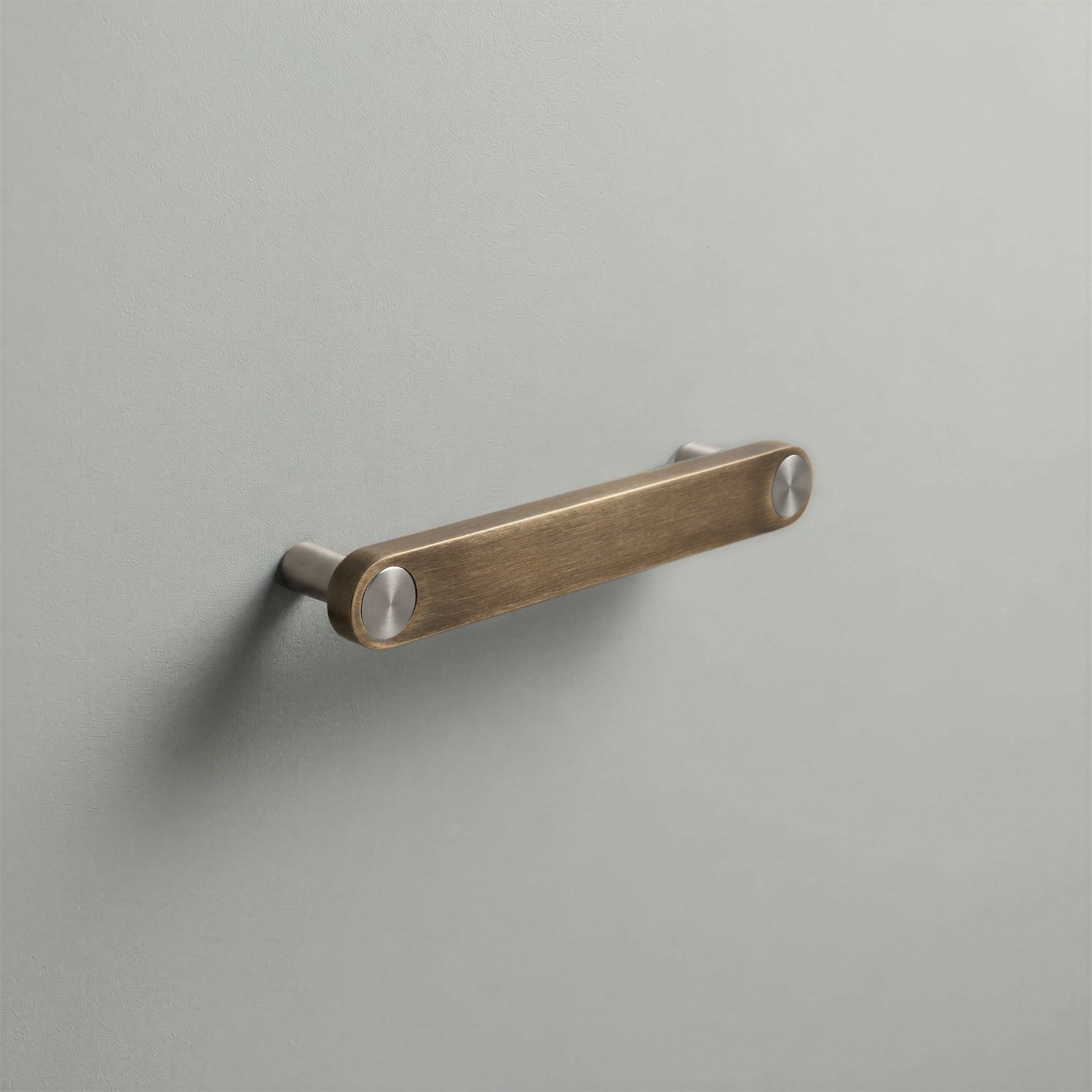 Aged Bronze Ensemble Handle in 128mm Centres with Brushed Steel button detail by Sloan Roberts.