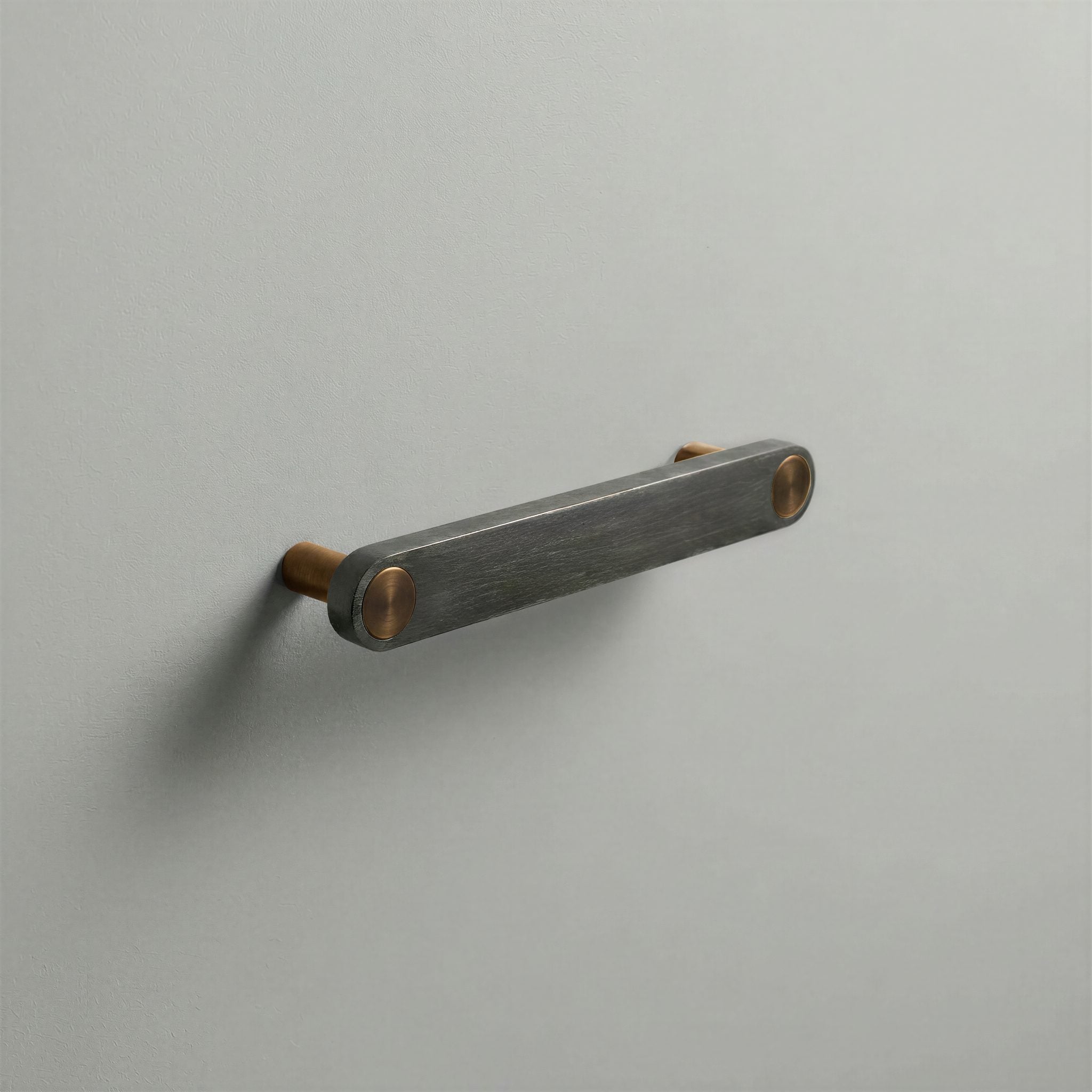 Gunmetal Ensemble Handle in 128mm Centres with Aged Bronze button detail by Sloan Roberts.