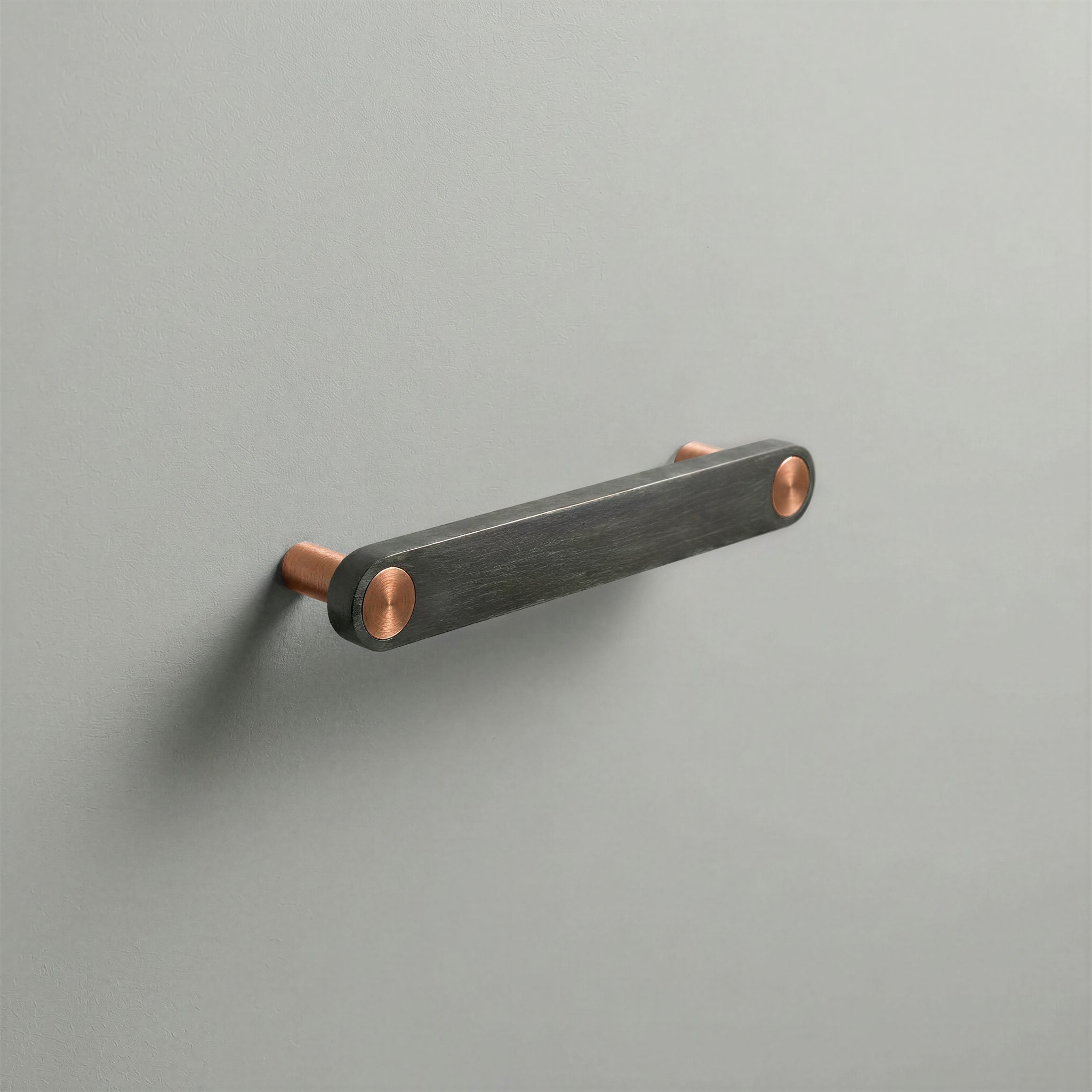 Gunmetal Ensemble Handle in 128mm Centres with Brushed Copper button detail by Sloan Roberts.