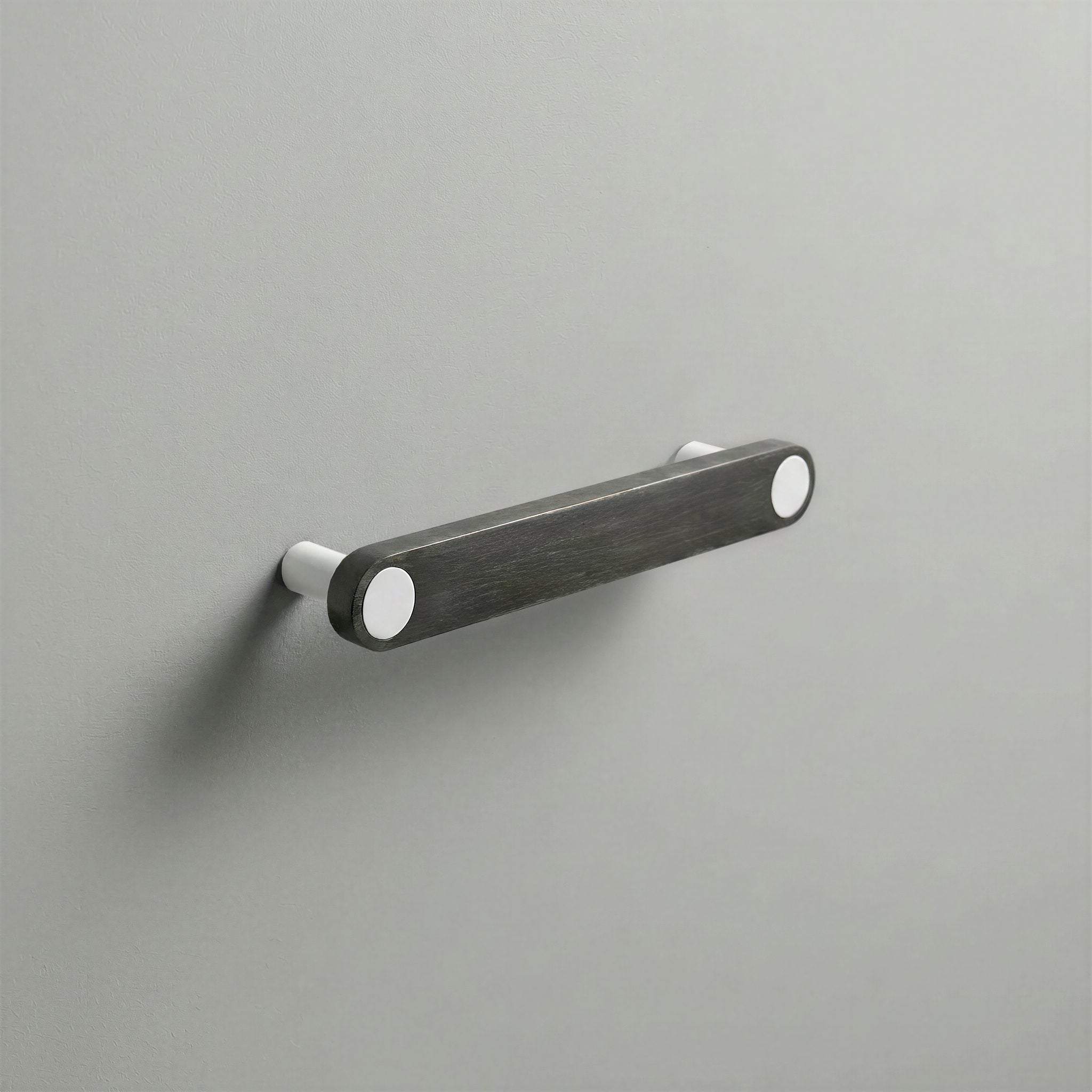 Gunmetal Ensemble Handle in 128mm Centres with Matte White button detail by Sloan Roberts.
