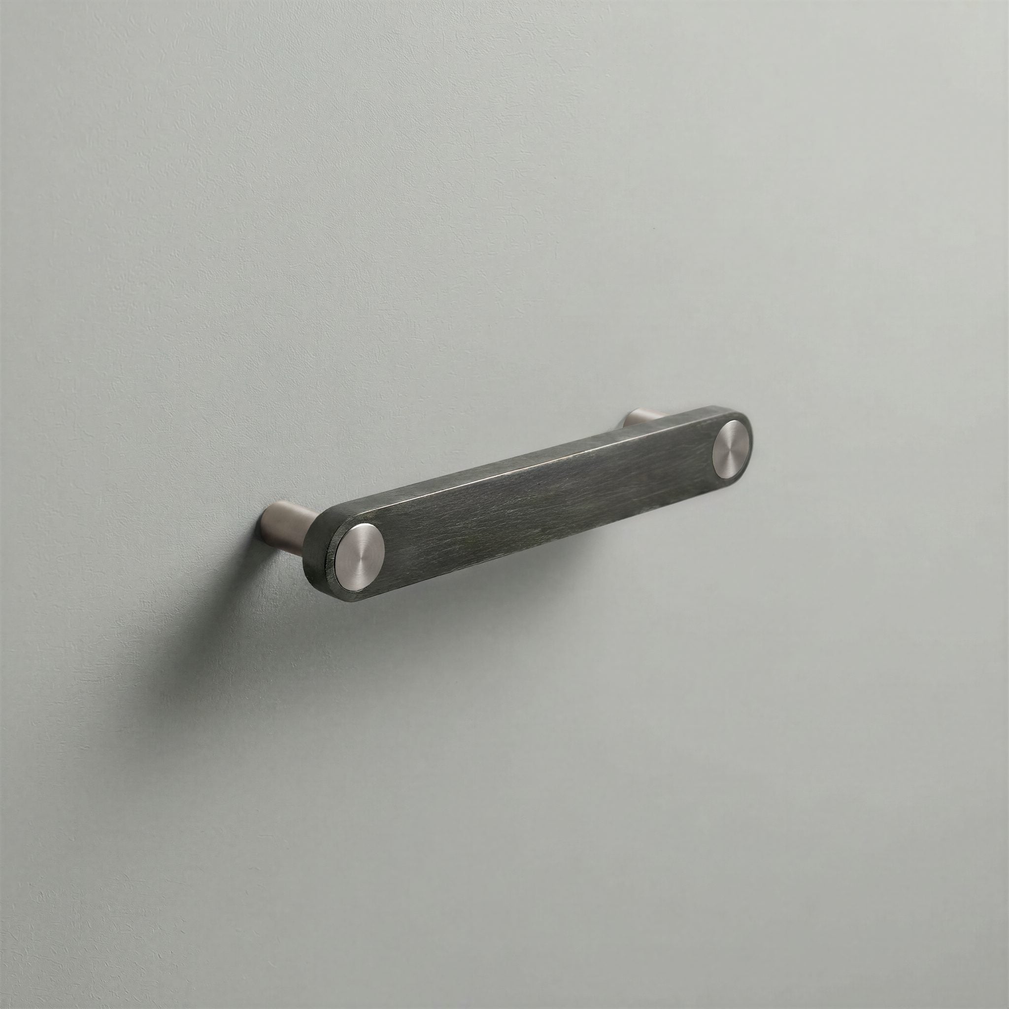 Gunmetal Ensemble Handle in 128mm Centres with Brushed Steel button detail by Sloan Roberts.
