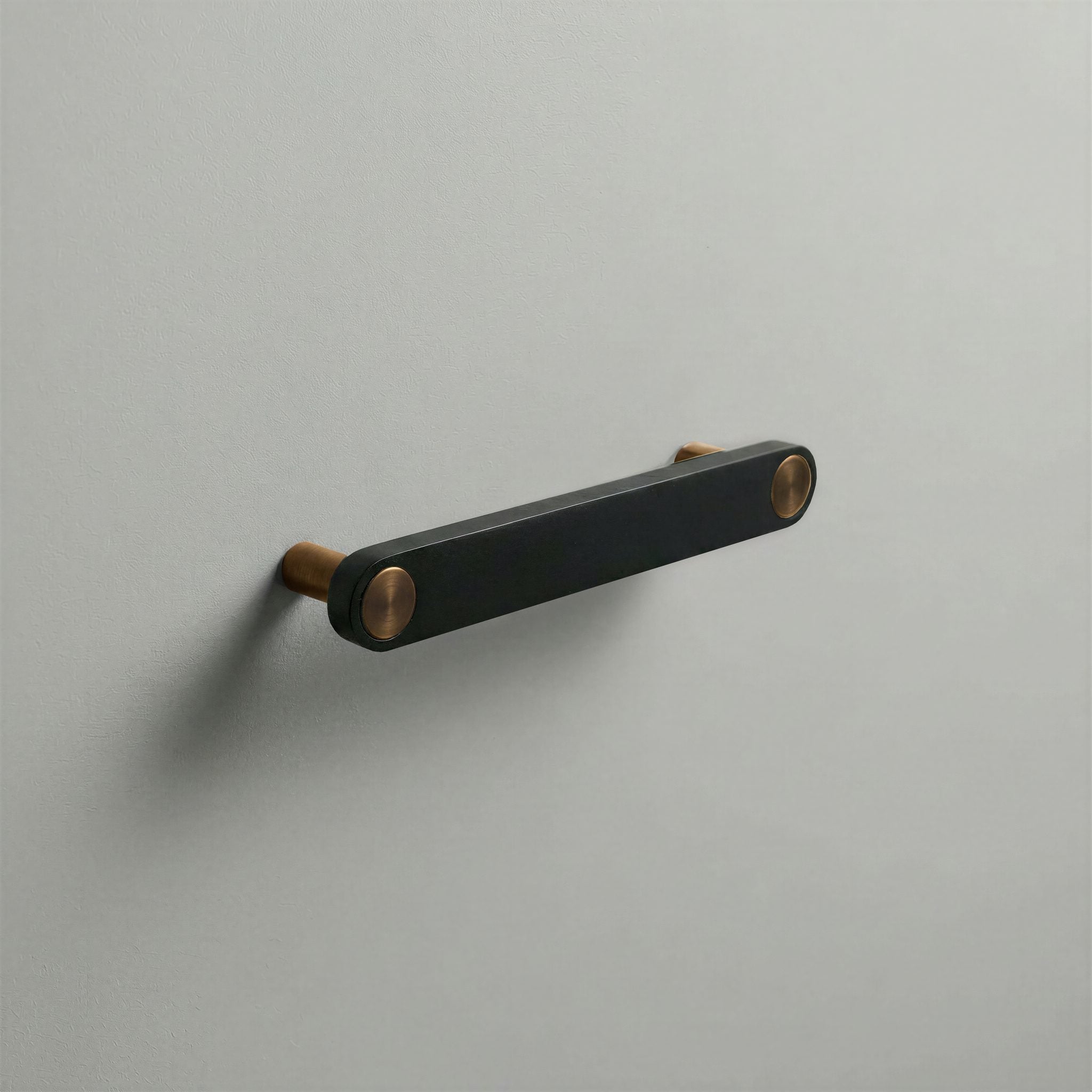 Matte Black Ensemble Handle in 128mm Centres with Aged Bronze button detail by Sloan Roberts.
