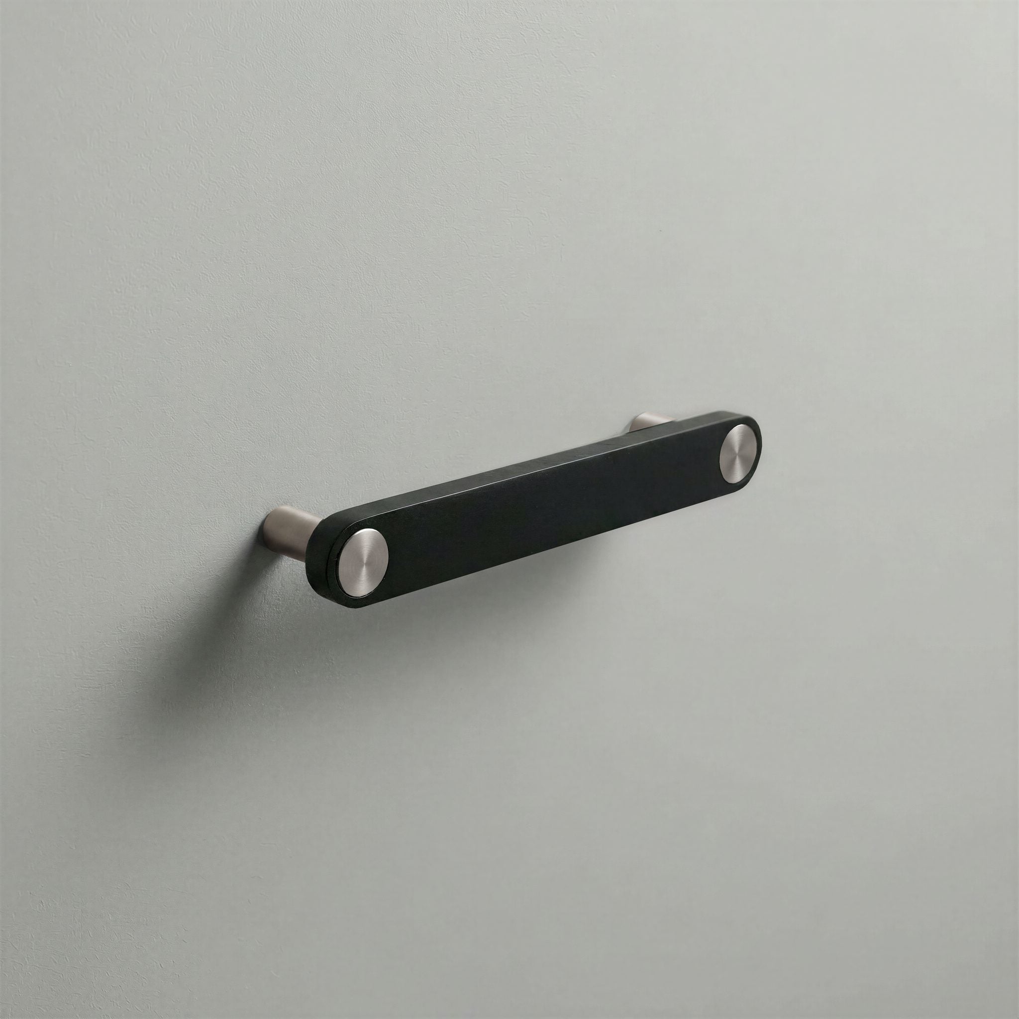 Matte Black Ensemble Handle in 128mm Centres with Brushed Steel button detail by Sloan Roberts.