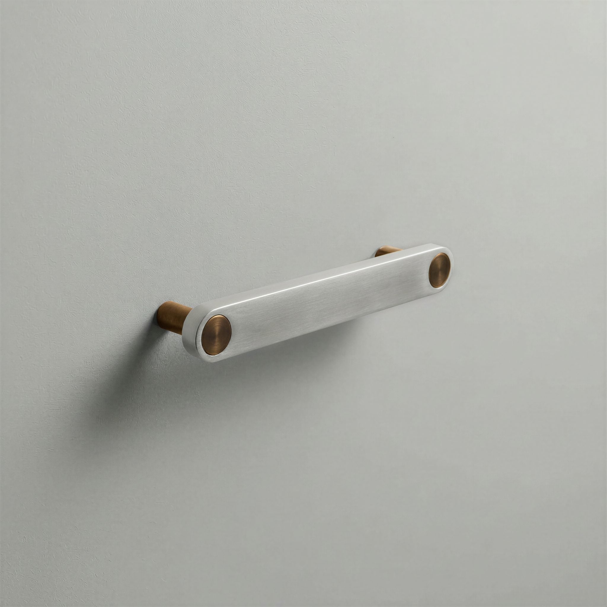 Brushed Steel Ensemble Handle in 128mm Centres with Aged Bronze button detail by Sloan Roberts.