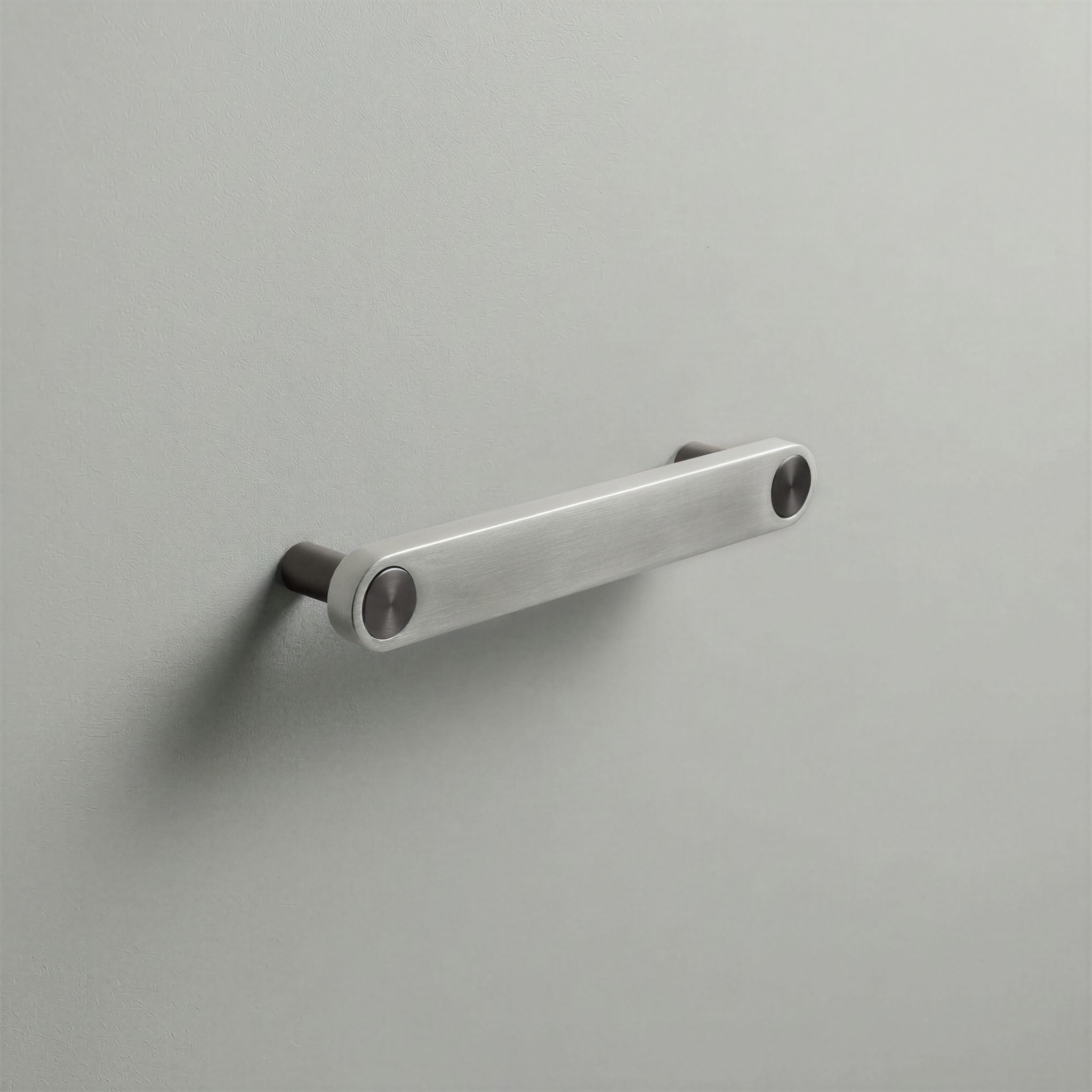 Brushed Steel Ensemble Handle in 128mm Centres with Gunmetal button detail by Sloan Roberts.
