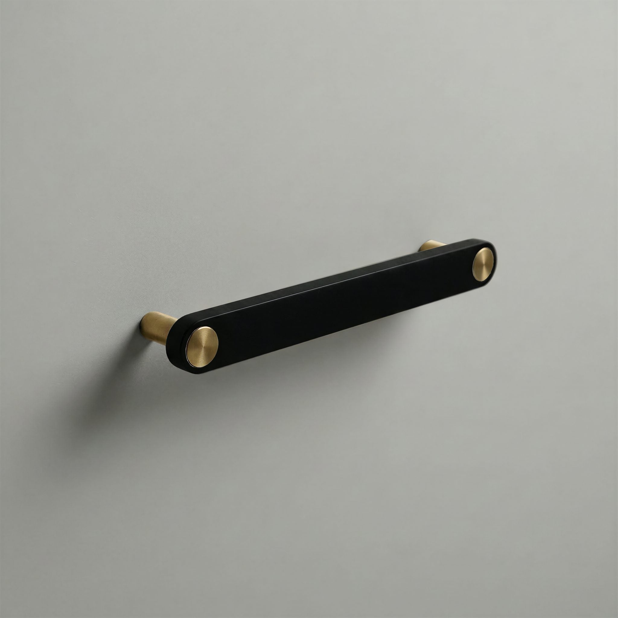 Matte Black Ensemble Handle in 160mm Centres with Brass button detail by Sloan Roberts.