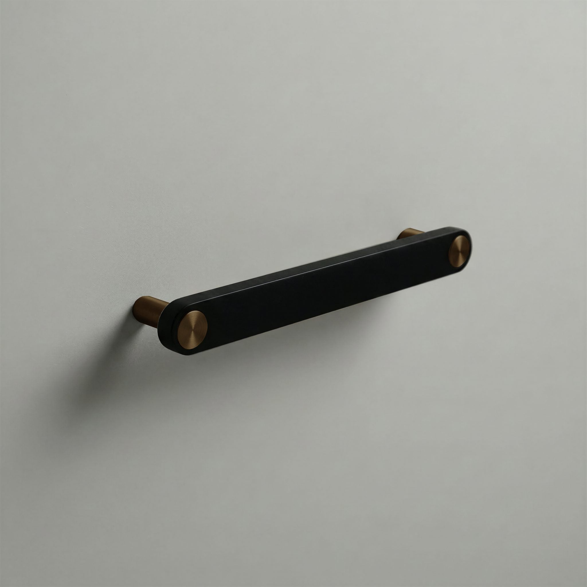 Matte Black Ensemble Handle in 160mm Centres with Aged Bronze button detail by Sloan Roberts.