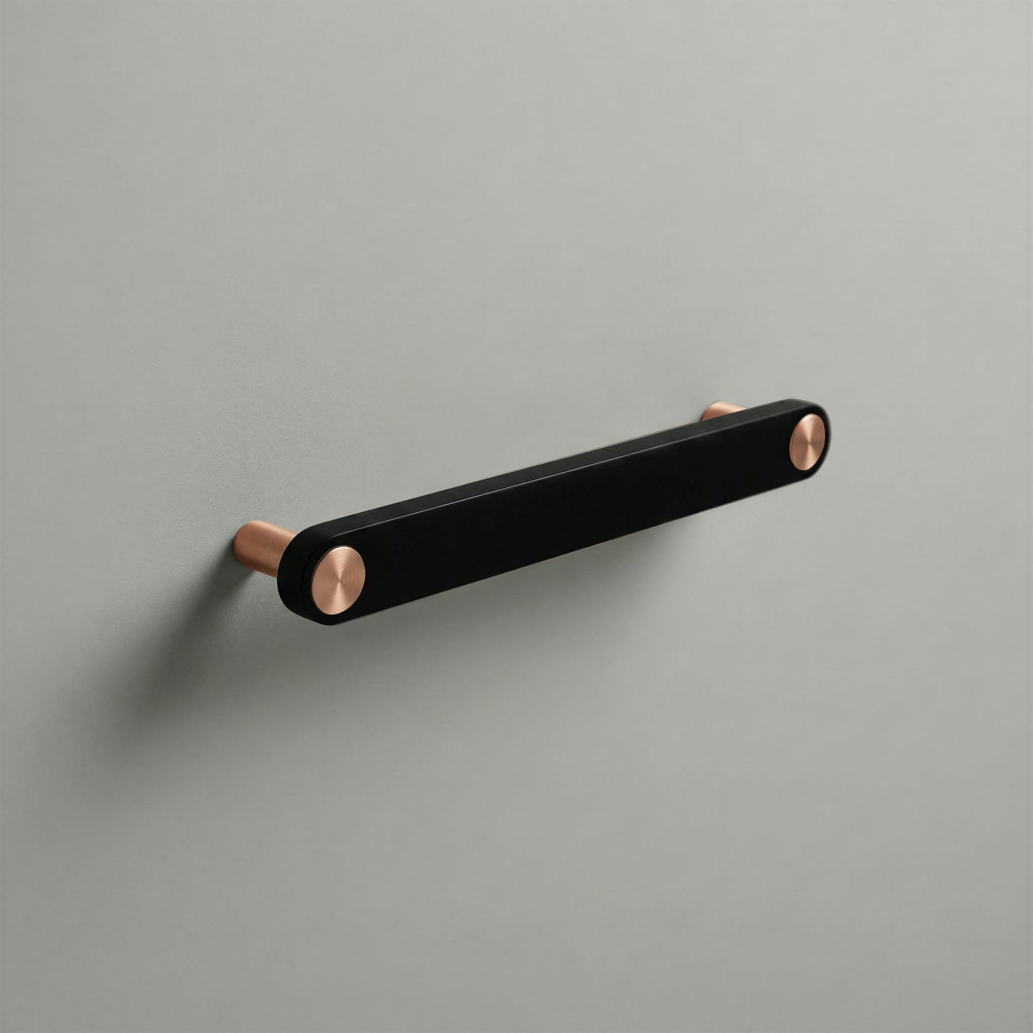 Matte Black Ensemble Handle in 160mm Centres with Brushed Copper button detail by Sloan Roberts.
