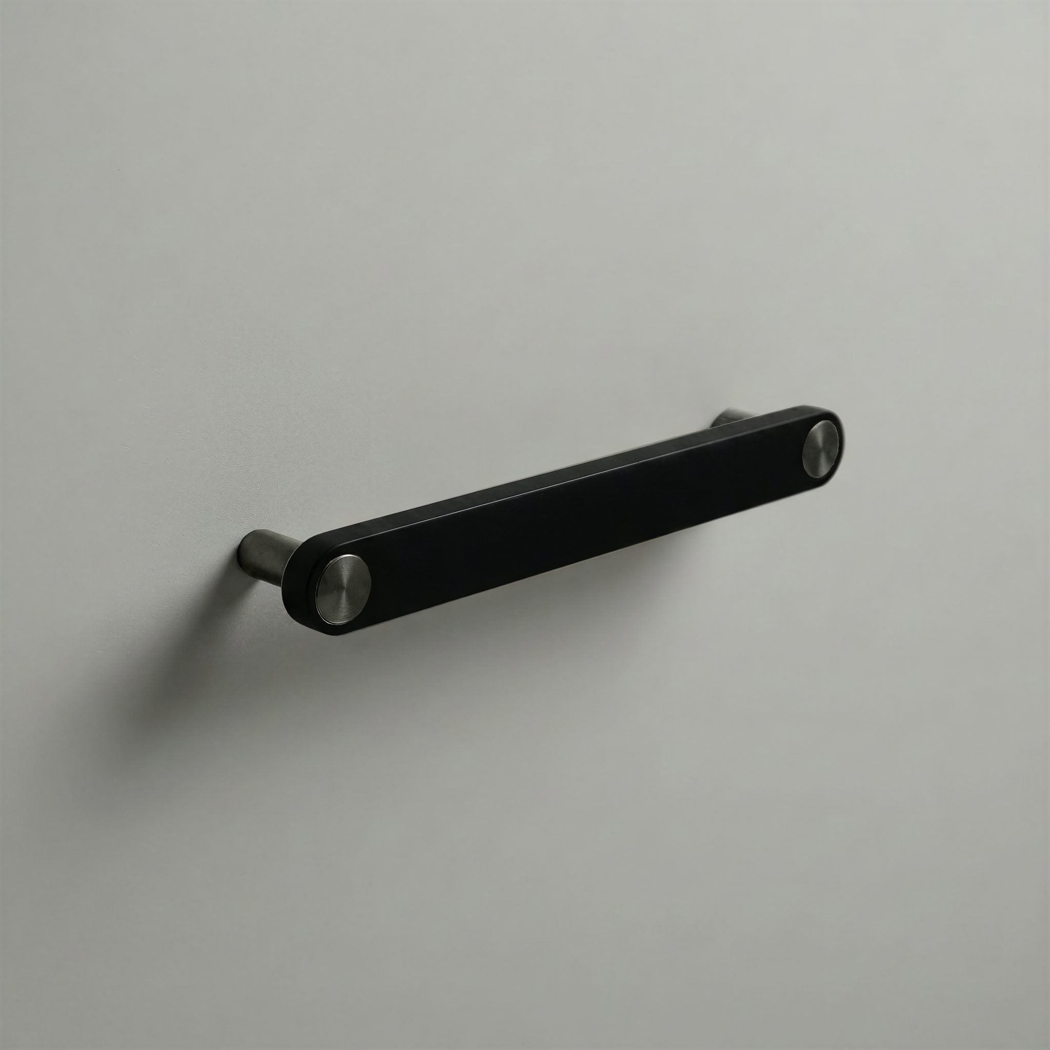 Matte Black Ensemble Handle in 160mm Centres with Gunmetal button detail by Sloan Roberts.