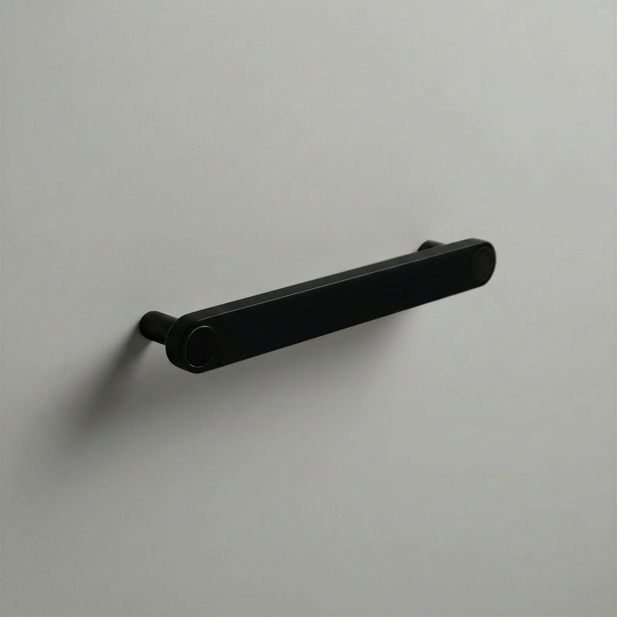 Matte Black Ensemble Handle in 160mm Centres with Matte Black button detail by Sloan Roberts.