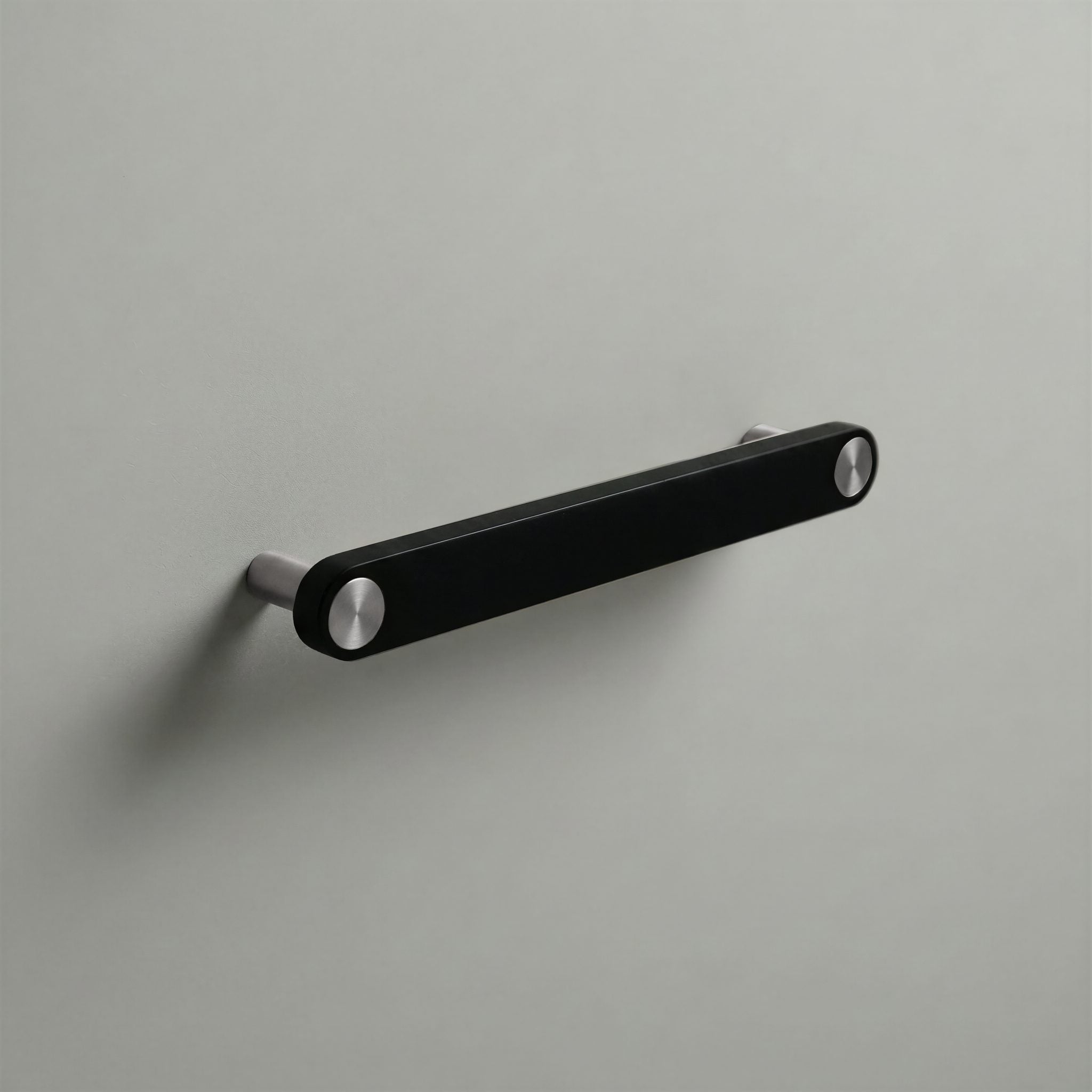 Matte Black Ensemble Handle in 160mm Centres with Brushed Steel button detail by Sloan Roberts.
