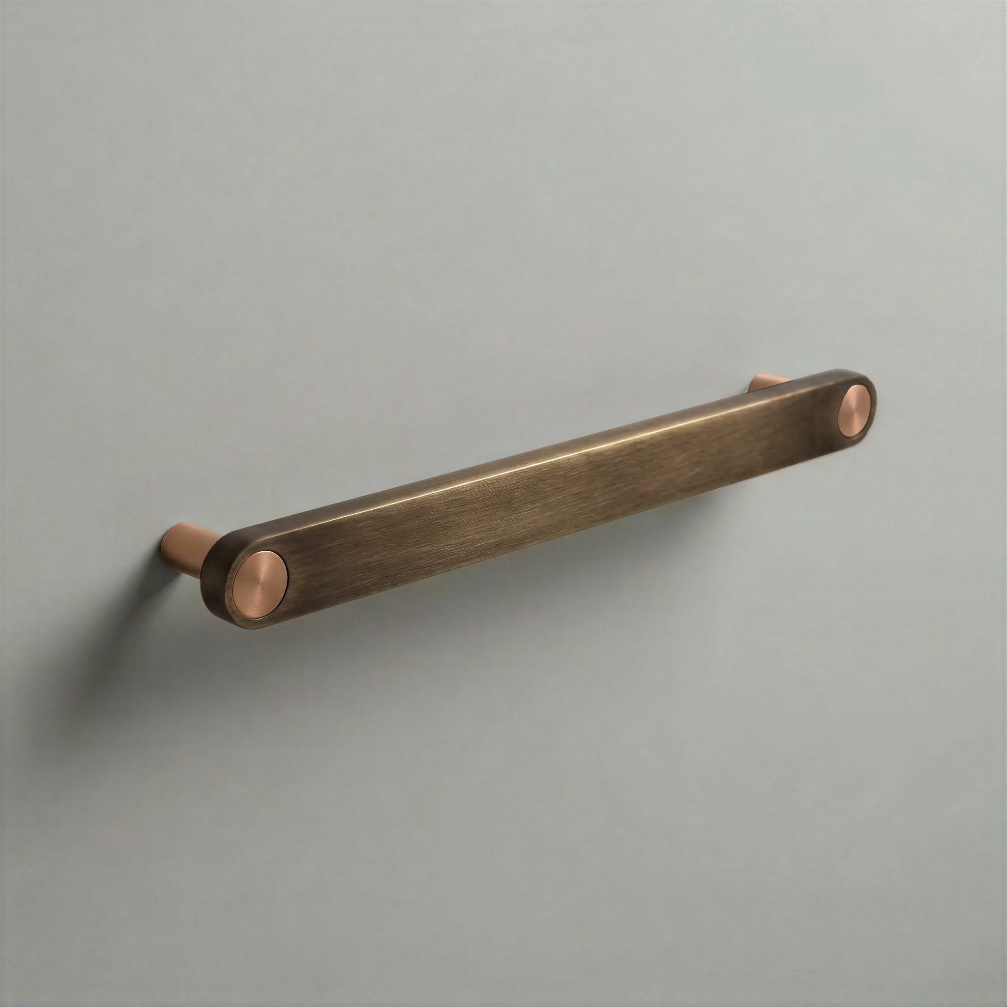 Aged Bronze Ensemble Handle in 192mm Centres with Brushed Copper button detail by Sloan Roberts.