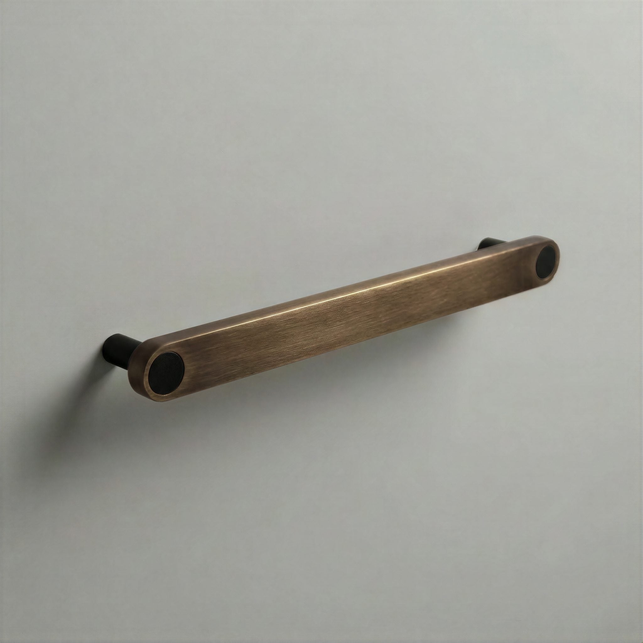 Aged Bronze Ensemble Handle in 192mm Centres with Matte Black button detail by Sloan Roberts.