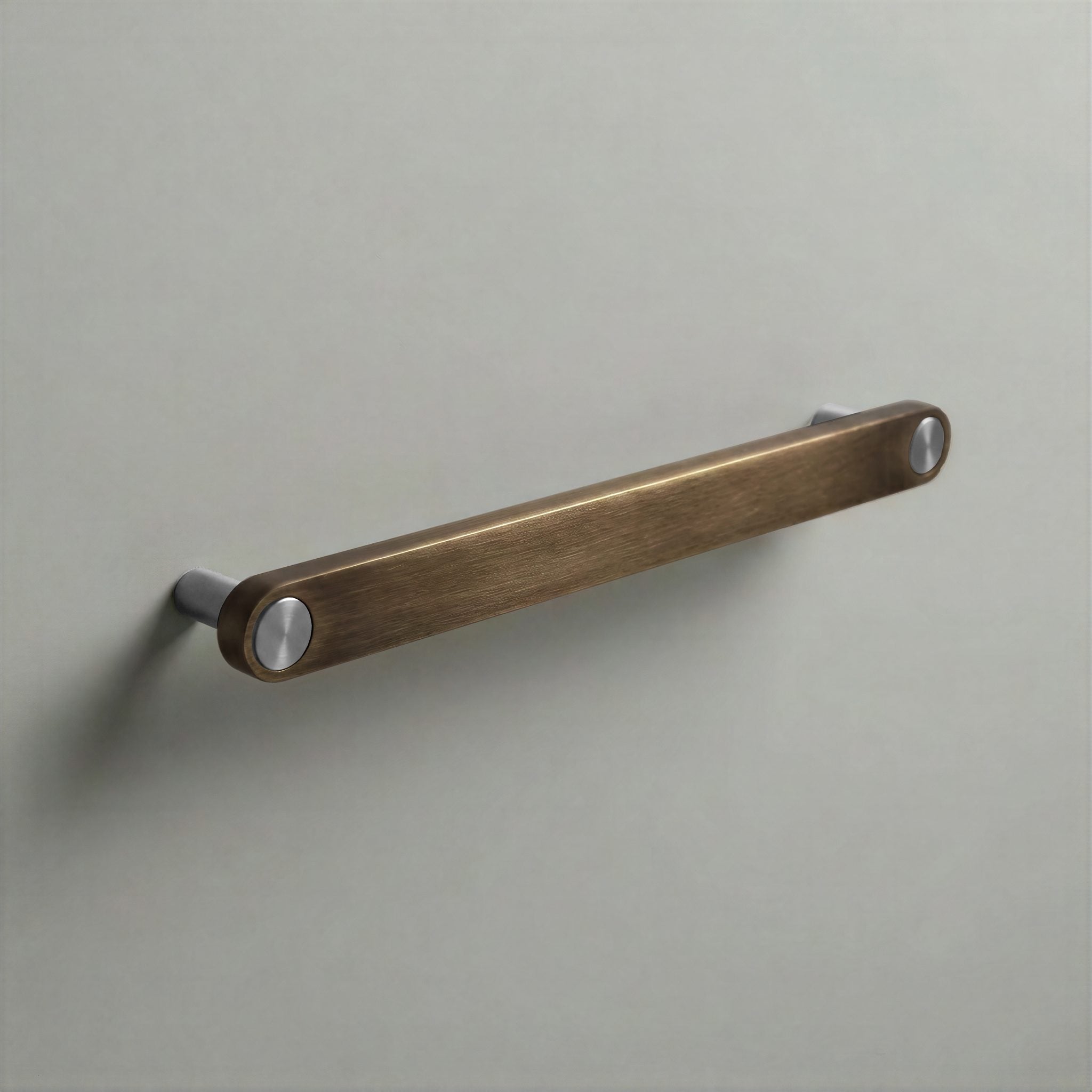 Aged Bronze Ensemble Handle in 192mm Centres with Brushed Steel button detail by Sloan Roberts.