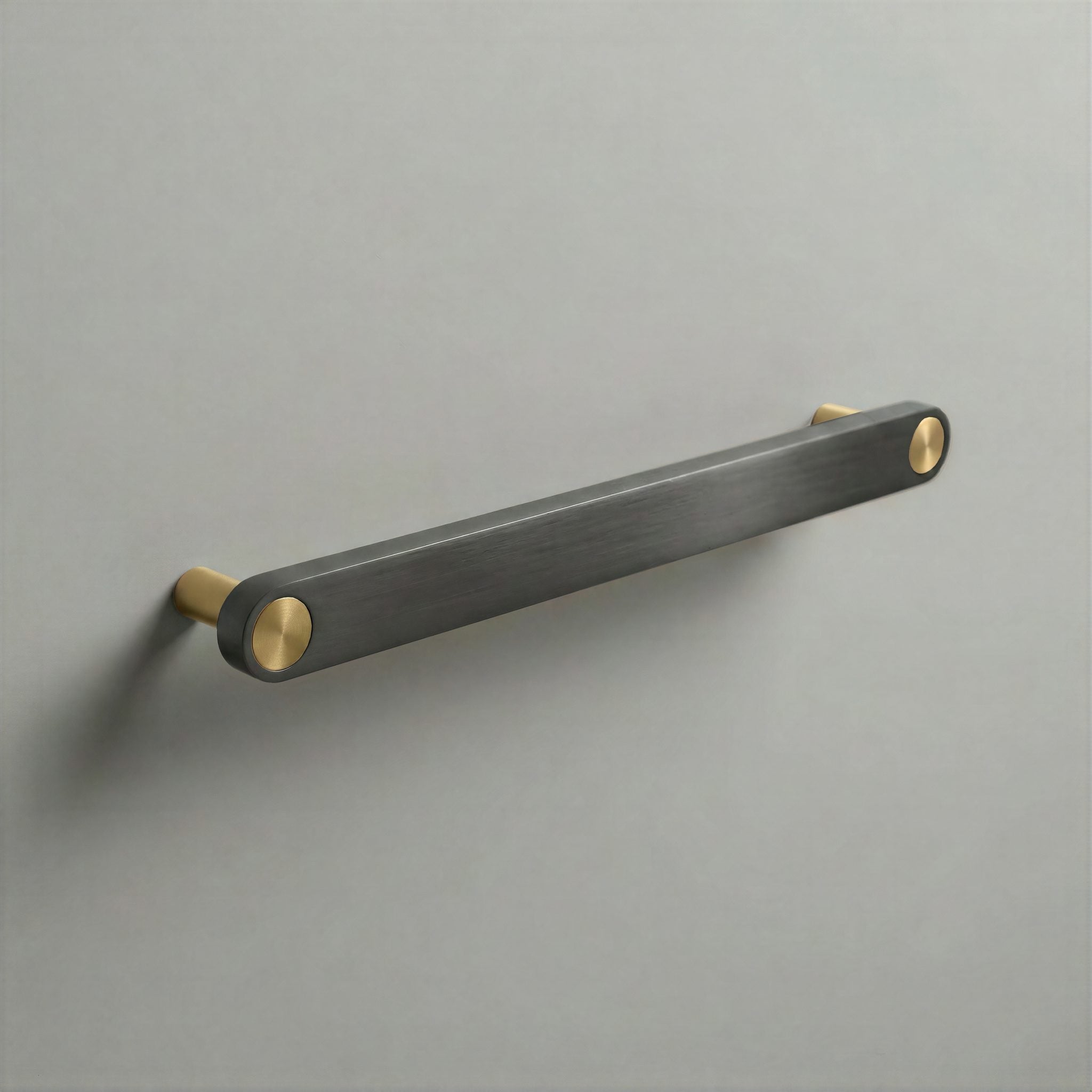 Gunmetal Ensemble Handle in 192mm Centres with Brass button detail by Sloan Roberts.