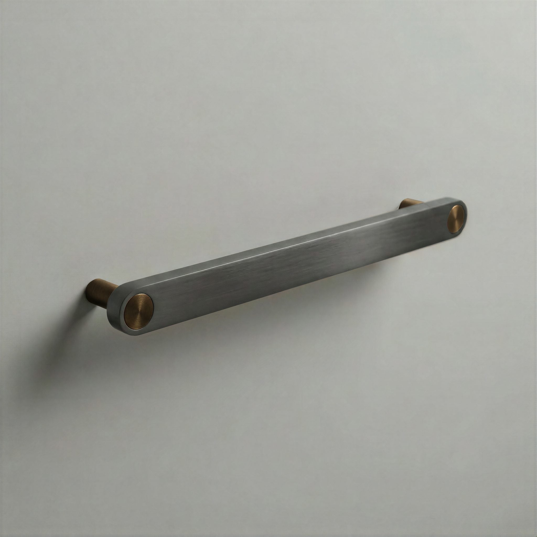 Gunmetal Ensemble Handle in 192mm Centres with Aged Bronze button detail by Sloan Roberts.