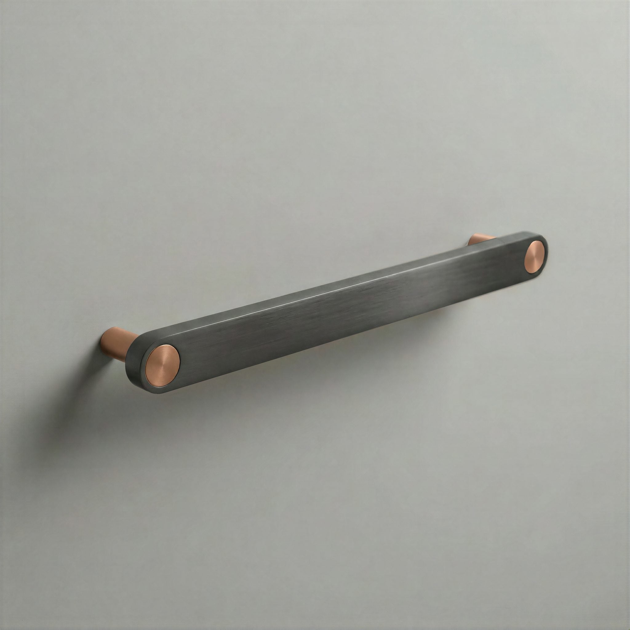 Gunmetal Ensemble Handle in 192mm Centres with Brushed Copper button detail by Sloan Roberts.