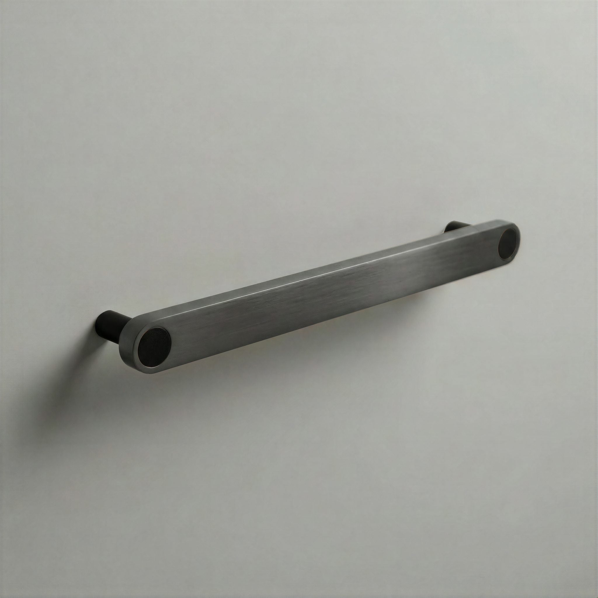 Gunmetal Ensemble Handle in 192mm Centres with Matte Black button detail by Sloan Roberts.