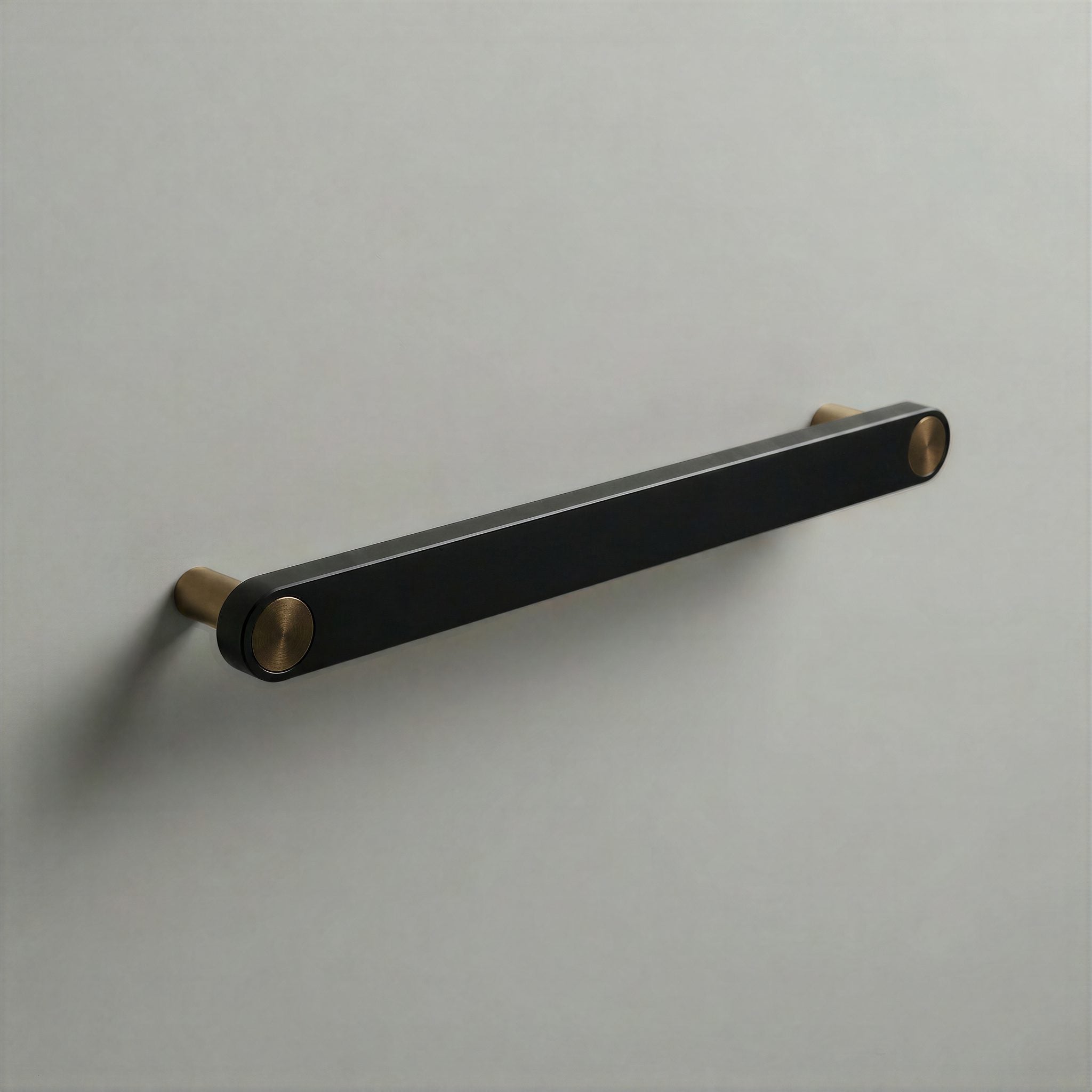 Matte Black Ensemble Handle in 192mm Centres with Aged Bronze button detail by Sloan Roberts.