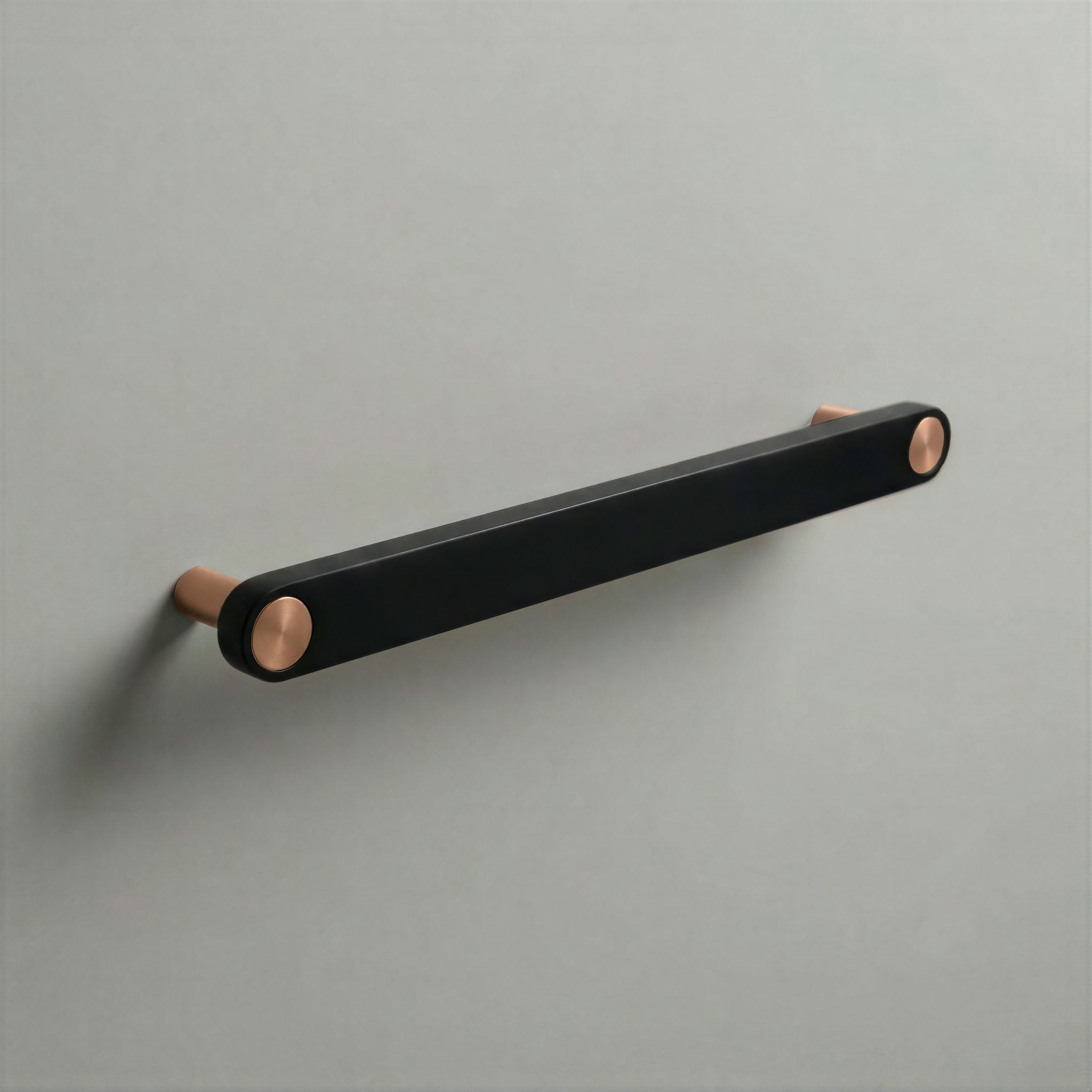 Matte Black Ensemble Handle in 192mm Centres with Brushed Copper button detail by Sloan Roberts.