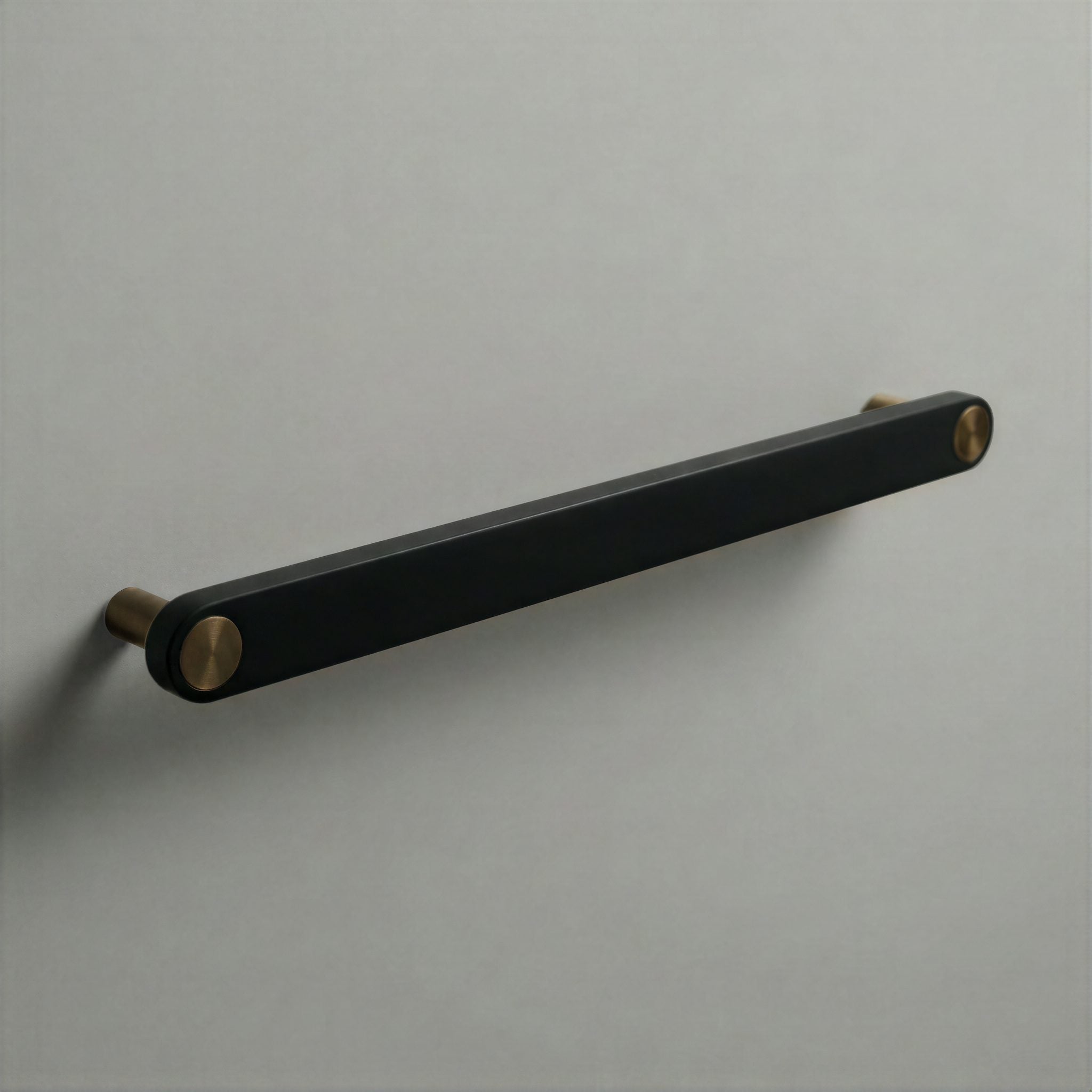 Matte Black Ensemble Handle in 224mm Centres with Aged Bronze button detail by Sloan Roberts.