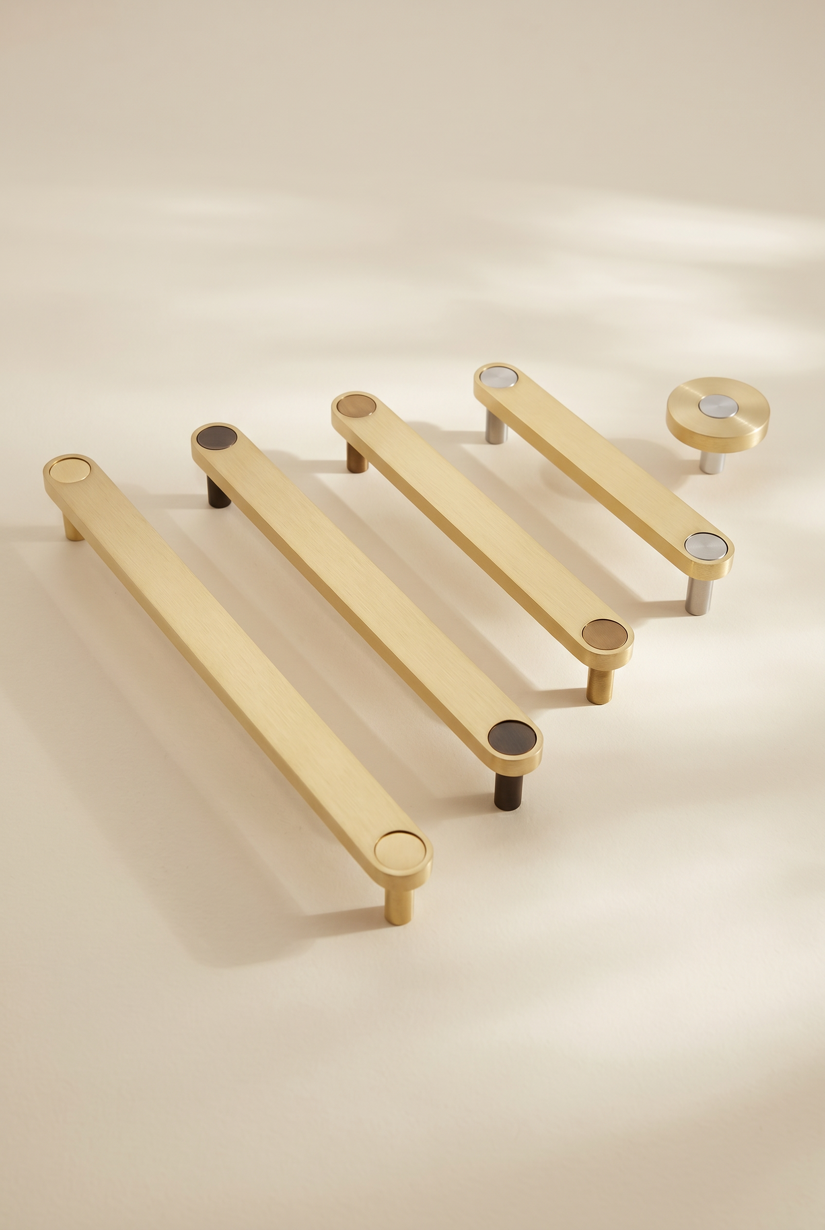 Ensemble Brass Handle — modular cabinet handle by Sloan Roberts. Solid brass finish, available as knob or bar in four sizes with choice of button detail. Designed and assembled in Melbourne.