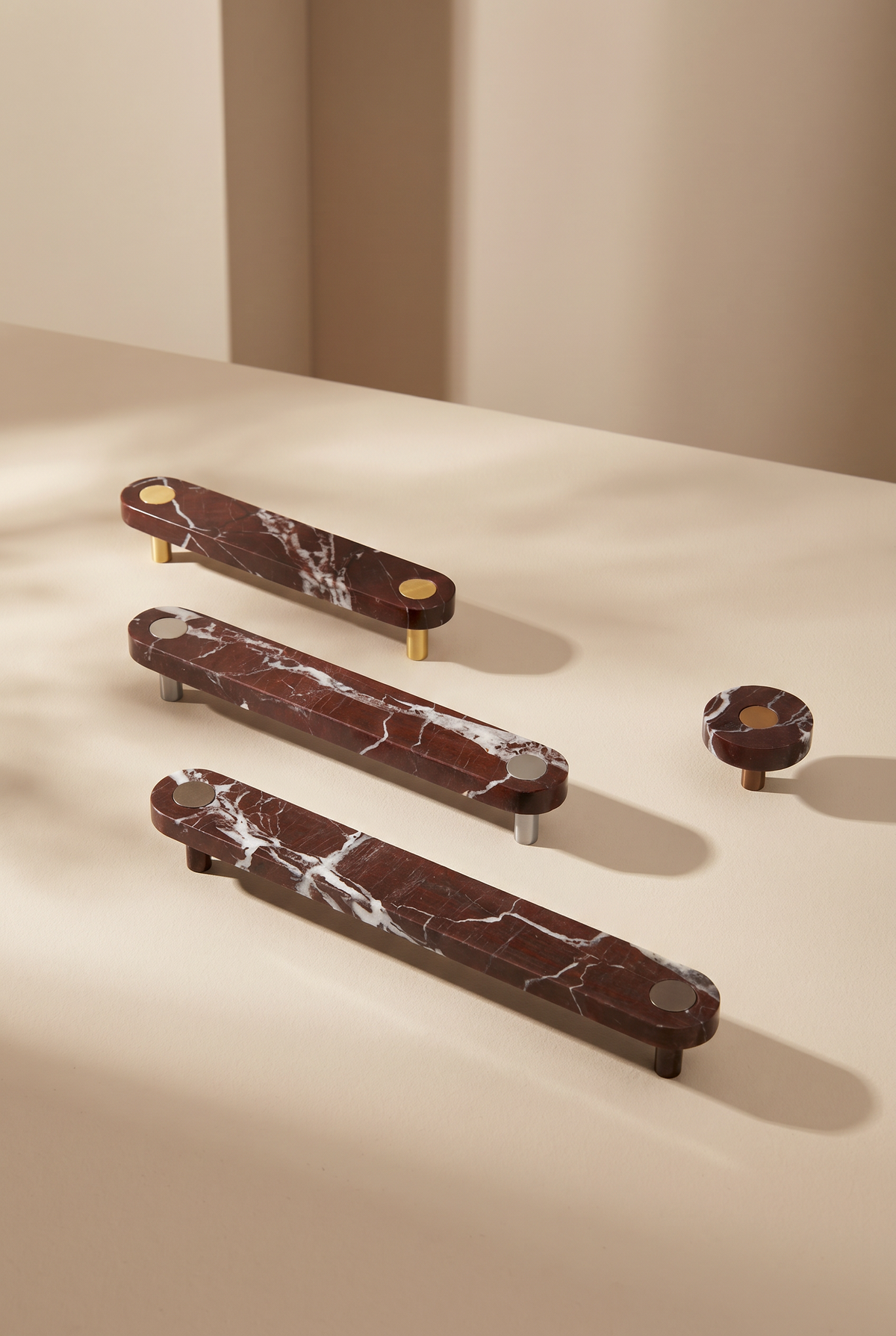 Ensemble Red Marble Handle — modular cabinet handle by Sloan Roberts. Crafted from Rosso Levanto marble sourced from Italy with choice of metallic button detail.