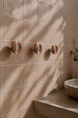 Ensemble Brushed Copper Hook — modular wall hook by Sloan Roberts. Warm brushed copper finish with choice of metallic button detail. Suited to bathrooms, ensuites and wardrobes. Designed and assembled in Melbourne.