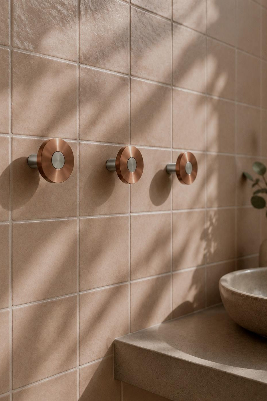 Ensemble Brushed Copper Hook — modular wall hook by Sloan Roberts. Warm brushed copper finish with choice of metallic button detail. Suited to bathrooms, ensuites and wardrobes. Designed and assembled in Melbourne.