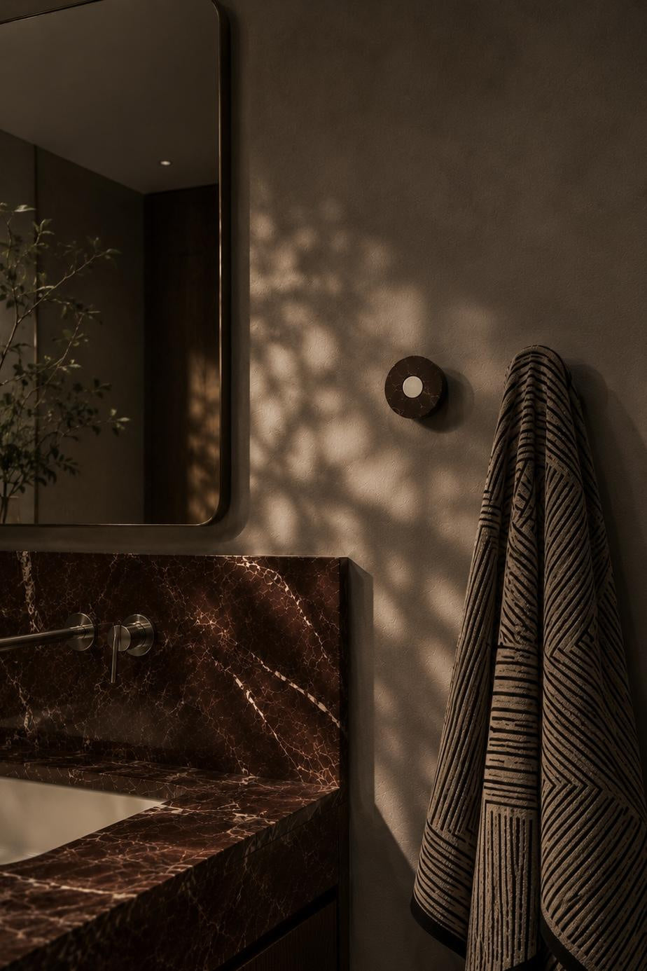 Ensemble Red Marble Hook — modular wall hook by Sloan Roberts. Crafted from Rosso Levanto marble with choice of metallic button detail. Suited to bathrooms, ensuites and wardrobes. Designed and assembled in Melbourne.