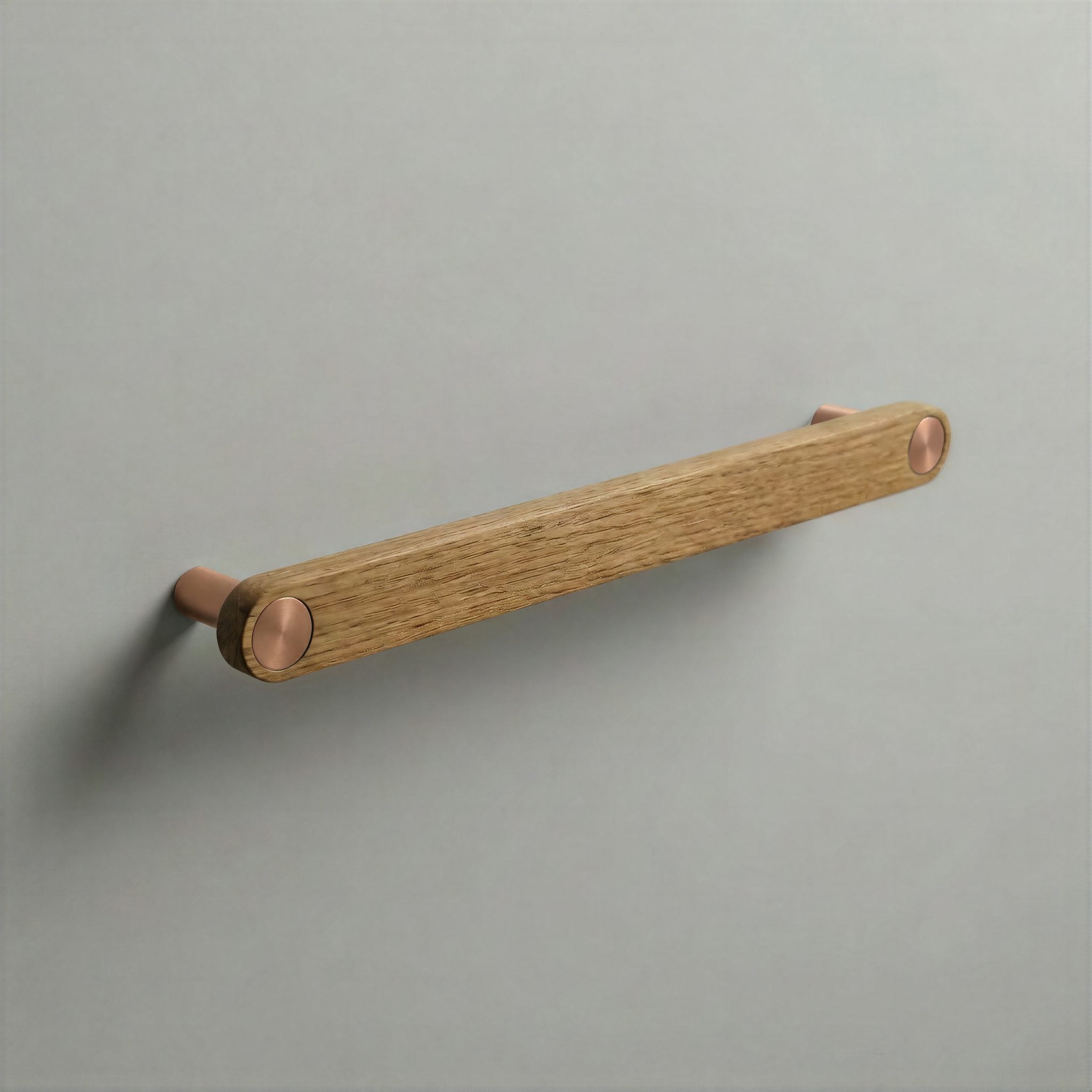 Oak Ensemble Handle in 192mm Centres with Brushed Copper button detail by Sloan Roberts.