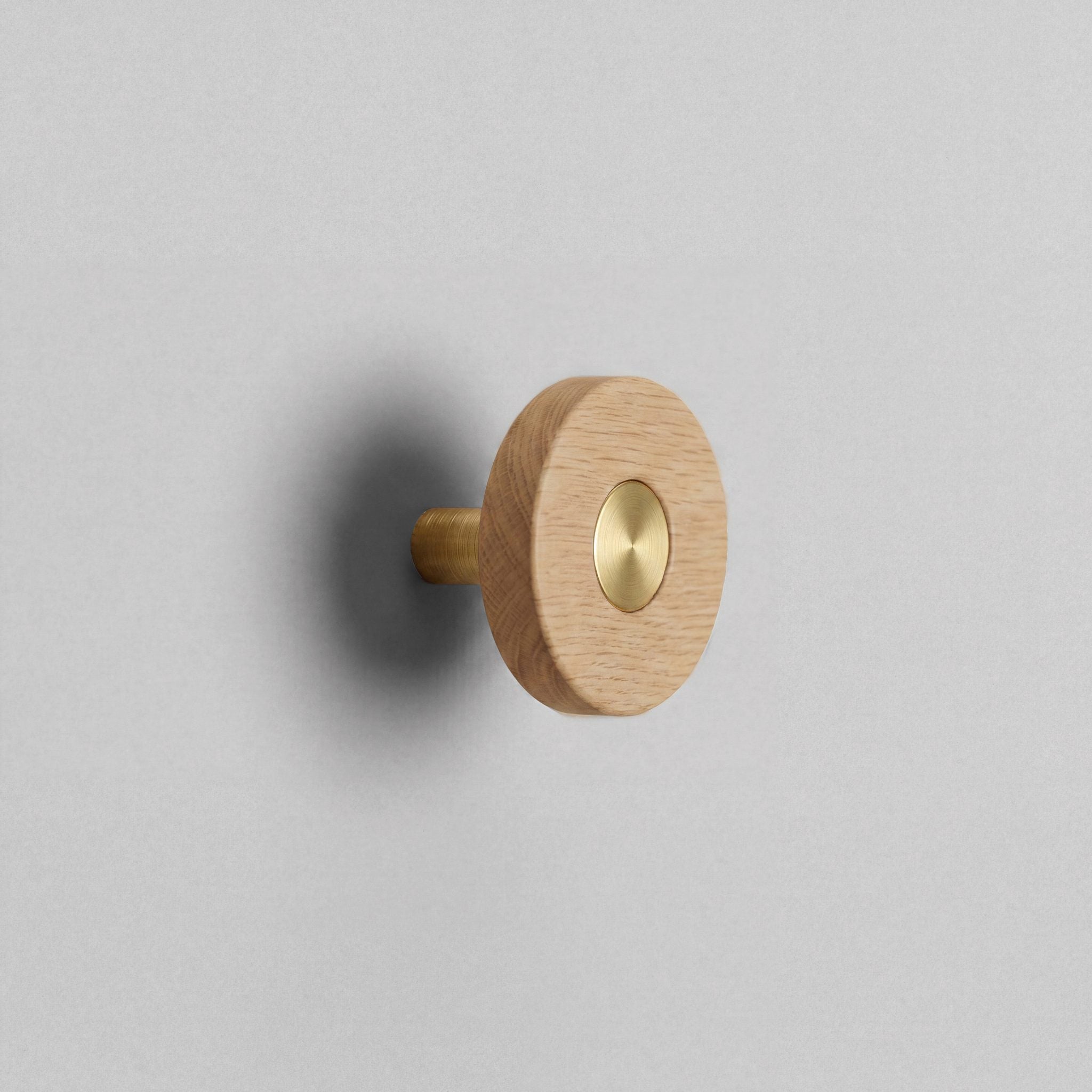 Oak Ensemble Handle in Knob size with Brass button detail by Sloan Roberts.
