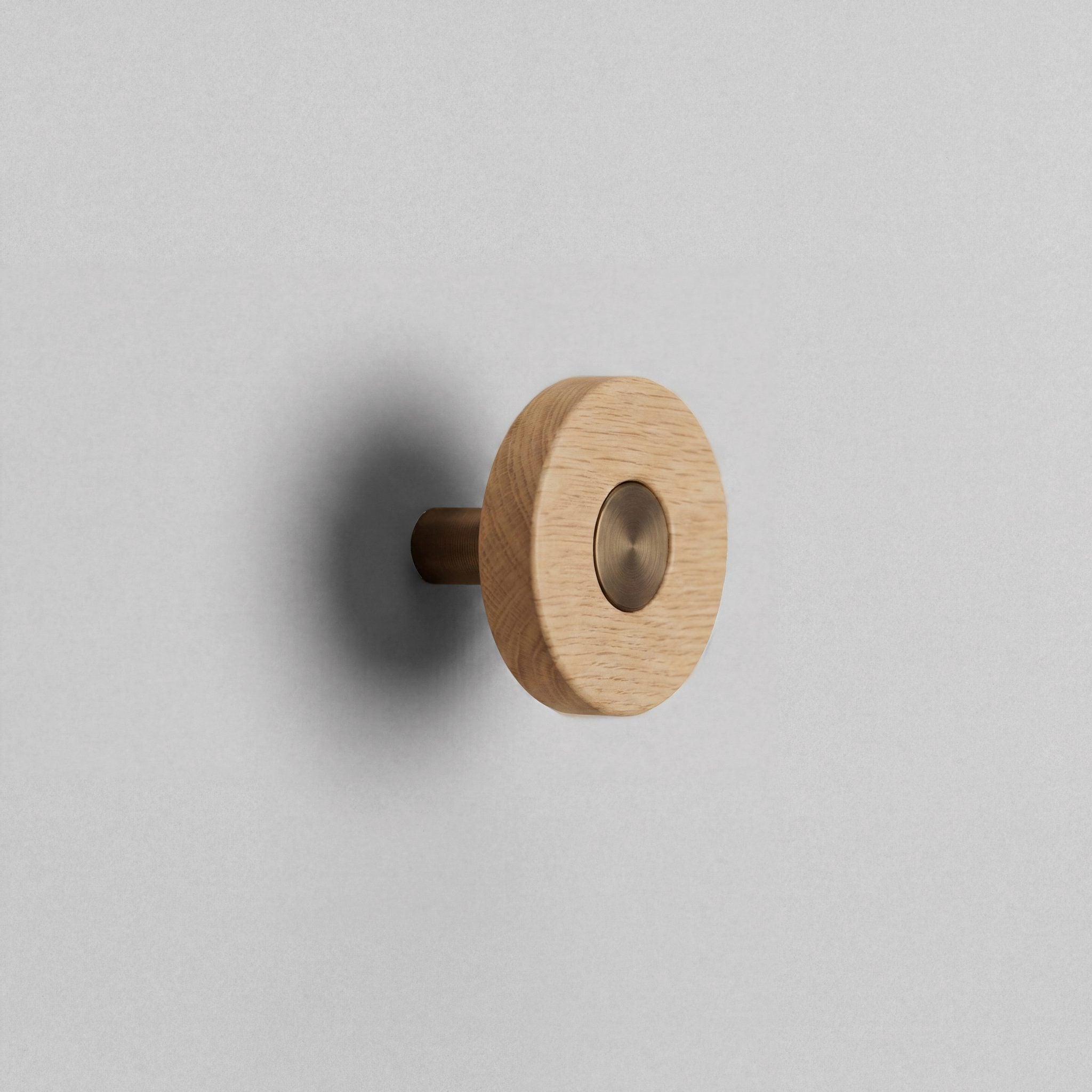 Oak Ensemble Handle in Knob size with Aged Bronze button detail by Sloan Roberts.