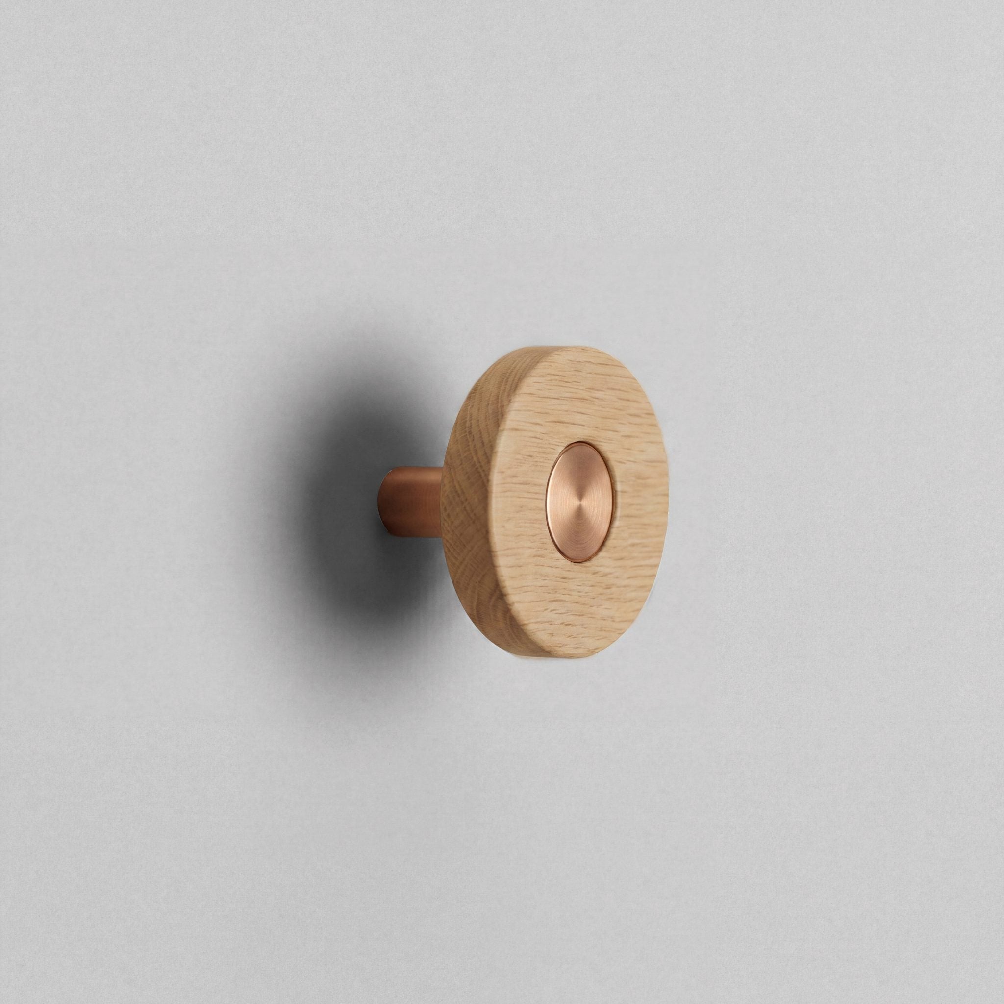 Oak Ensemble Handle in Knob size with Brushed Copper button detail by Sloan Roberts.