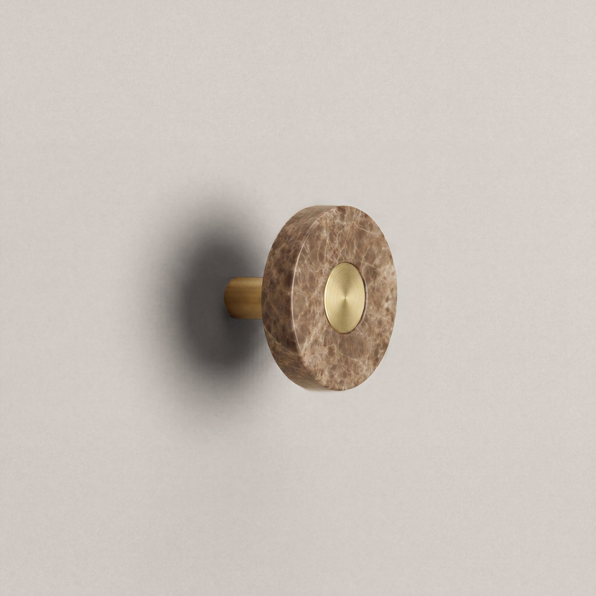 Latte Marble Ensemble Handle in Knob size with Brass button detail by Sloan Roberts.