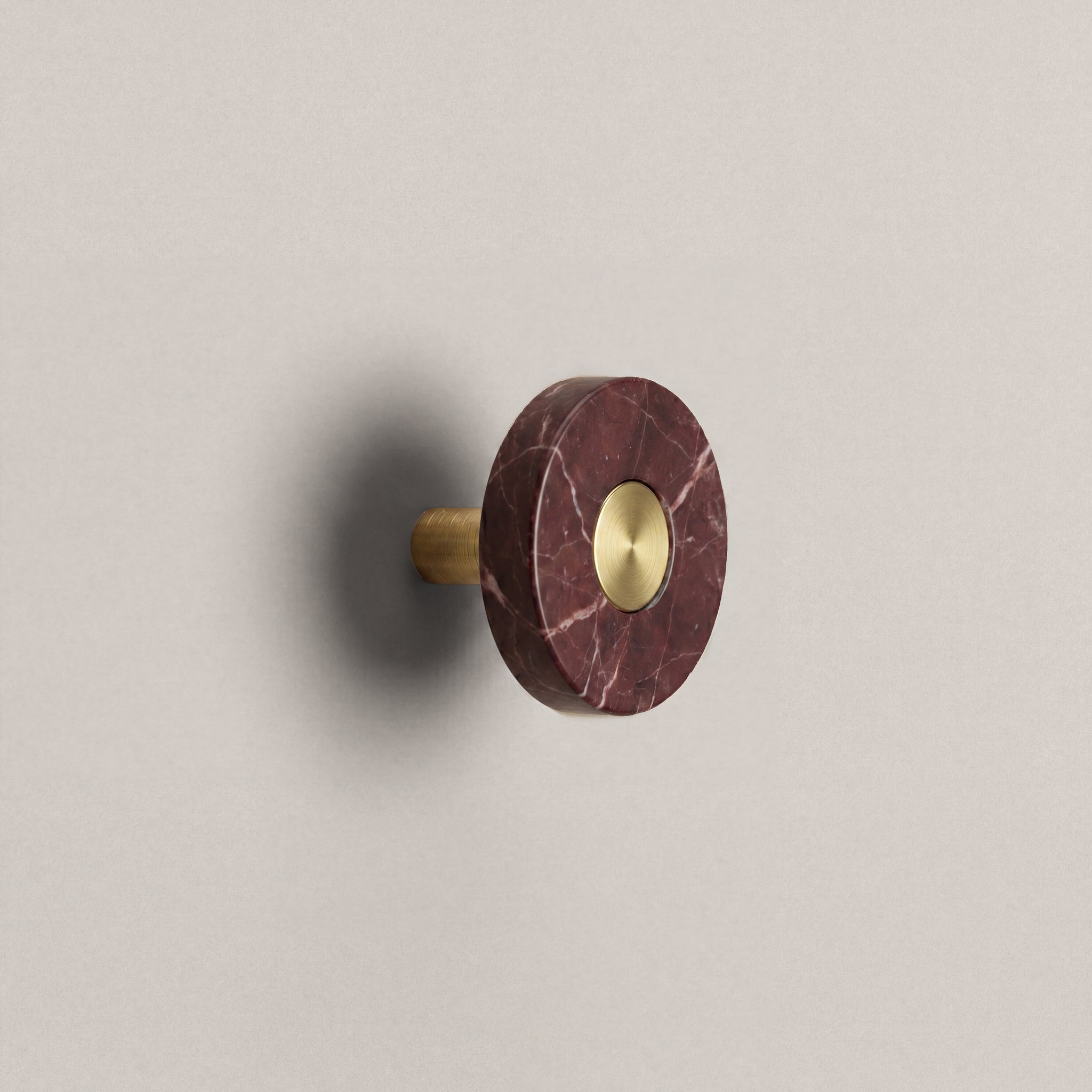 Red Marble Ensemble Handle in Knob size with Brass button detail by Sloan Roberts.
