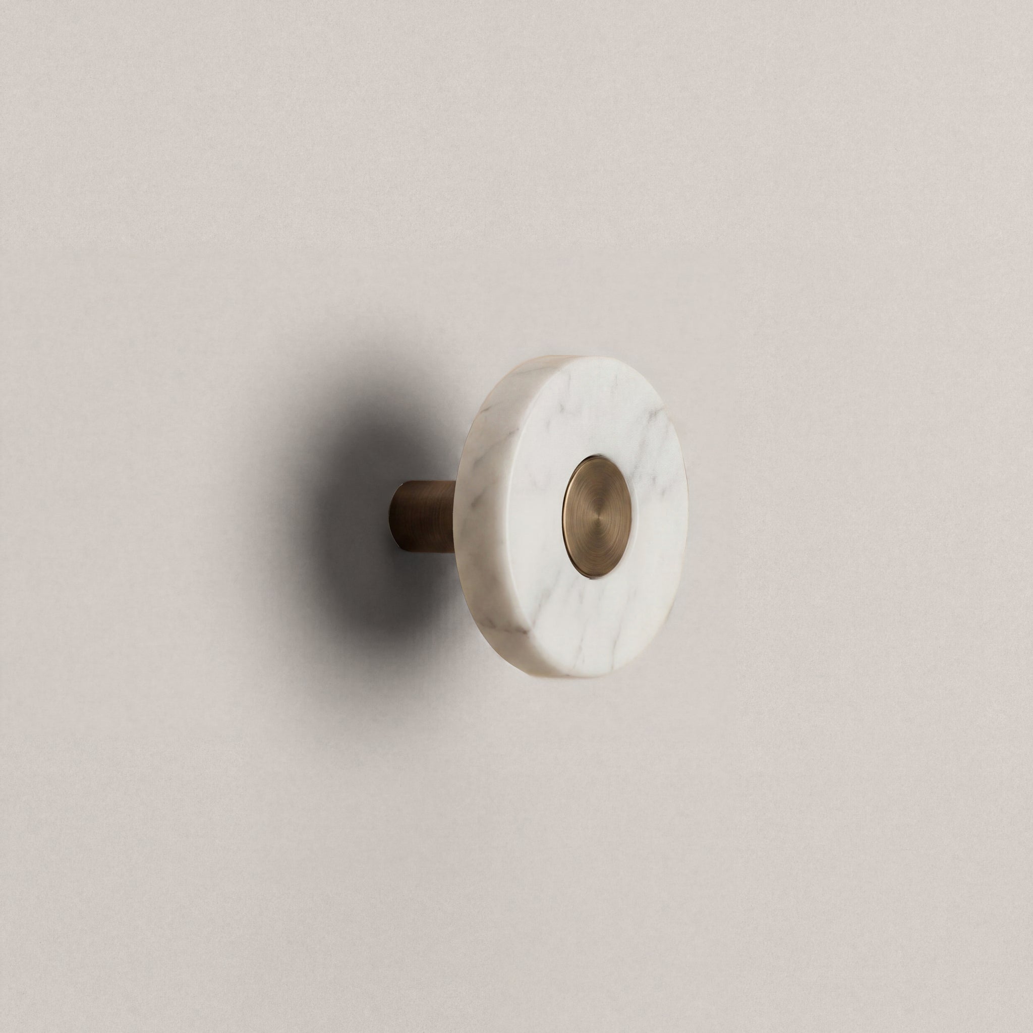 White Marble Ensemble Handle in Knob size with Aged Bronze button detail by Sloan Roberts.