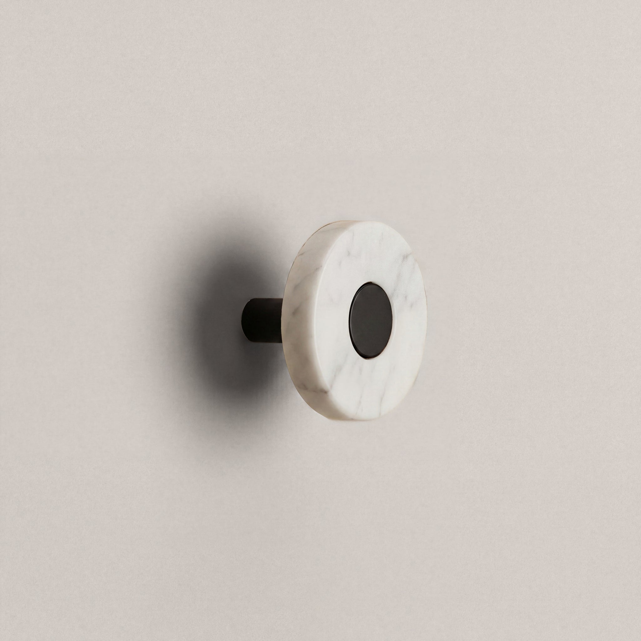 White Marble Ensemble Handle in Knob size with Matte Black button detail by Sloan Roberts.